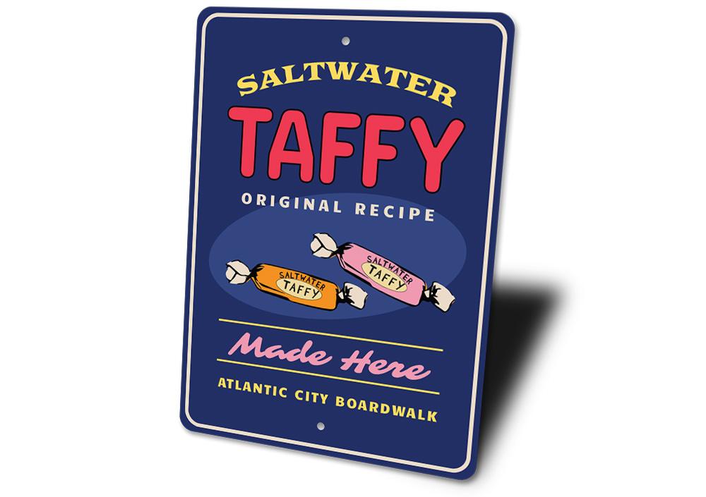 Saltwater Taffy Made Here decorative metal sign, featuring vibrant colors and a beach-themed design, perfect for coastal decor.