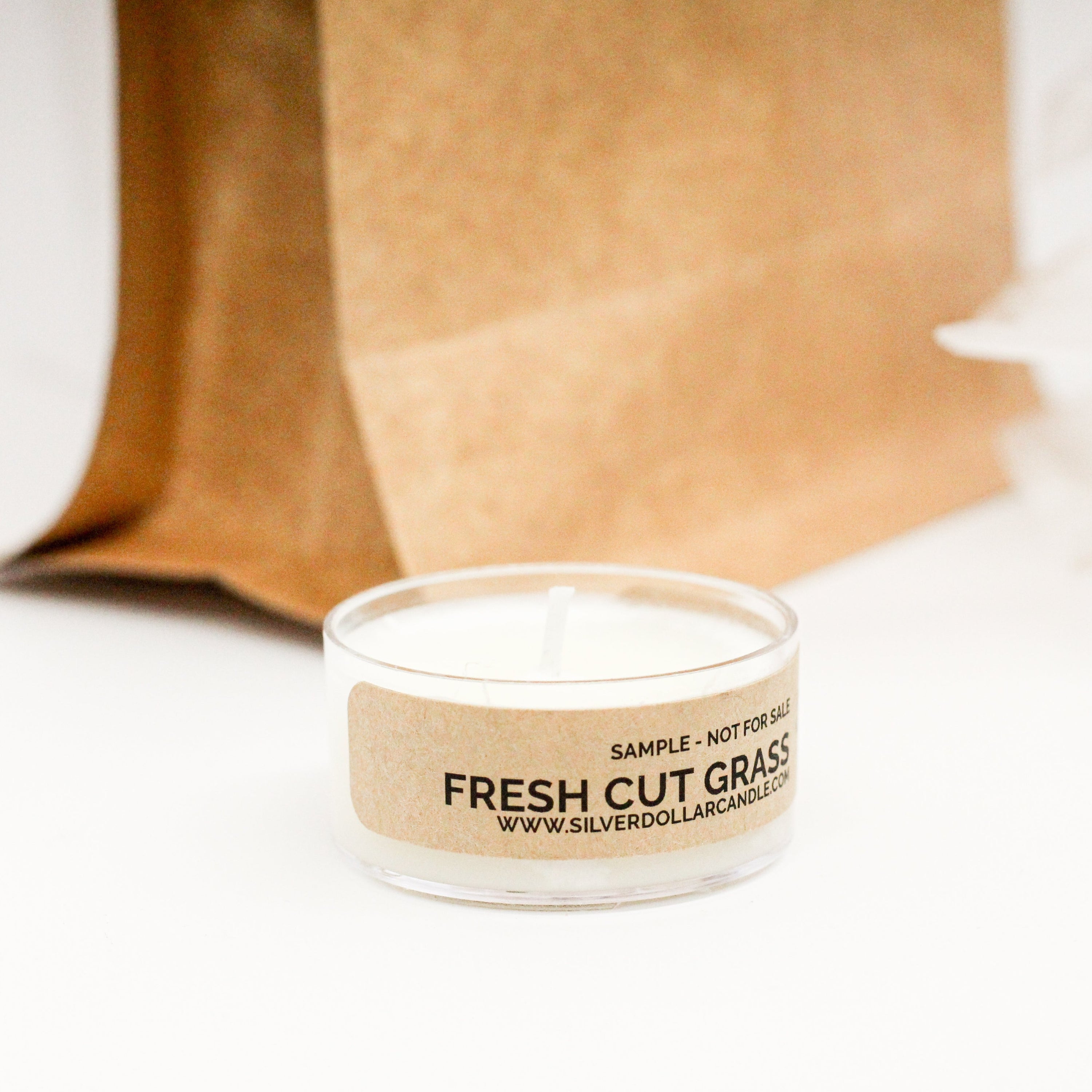 Sample Pack of 10 Tea Light Candles showcasing various fragrances in small, elegant holders.