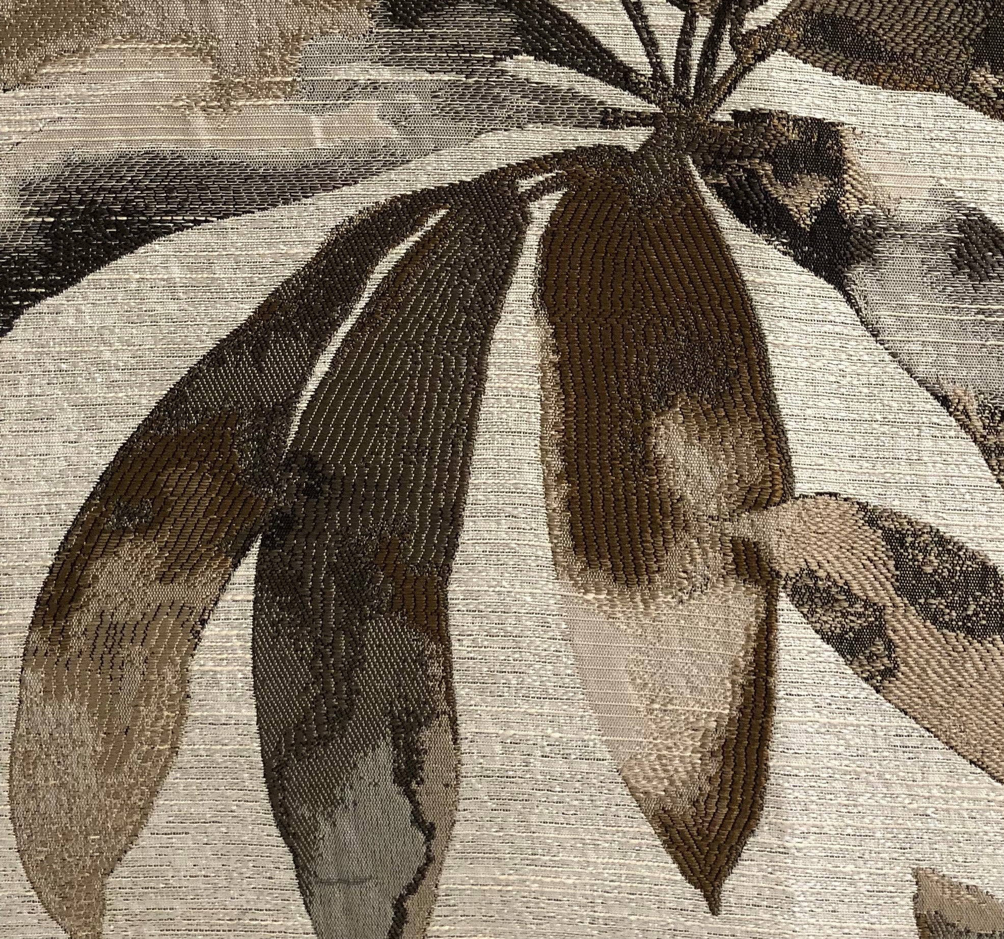 Santorini Cove luxury throw pillow in beige and brown tones, showcasing elegant design and quality craftsmanship.