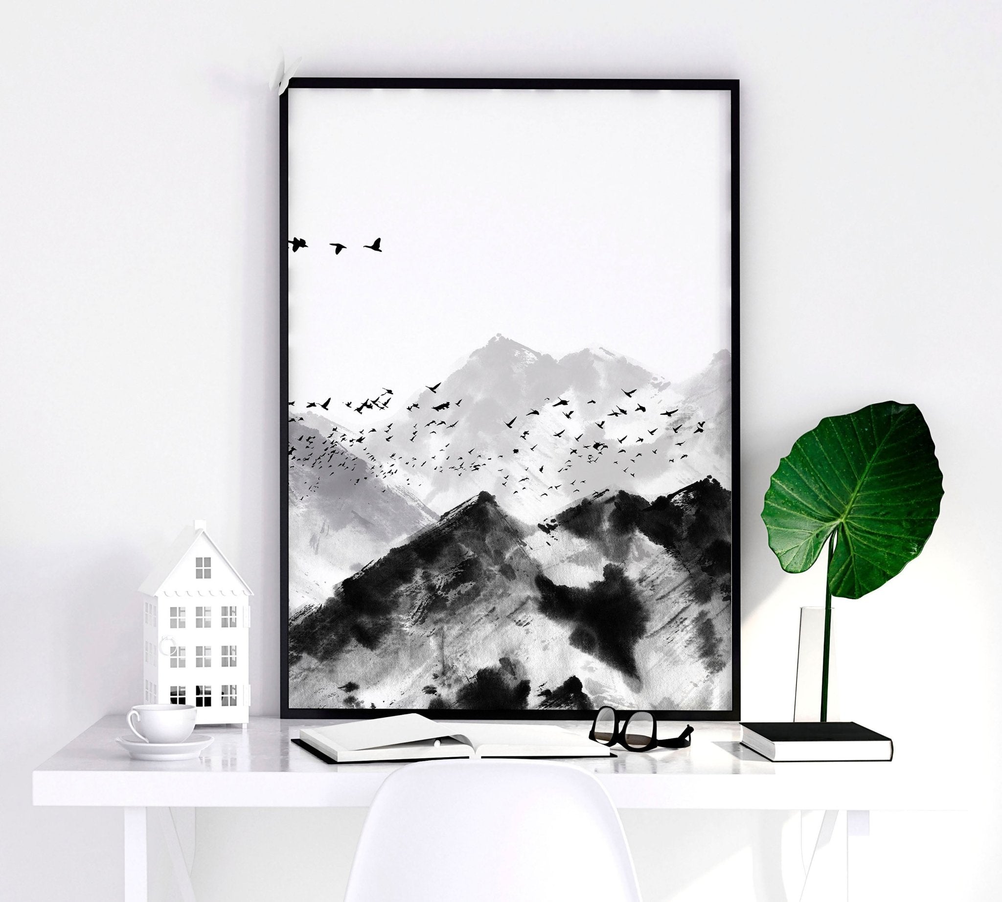 Set of 3 Scandi wall art prints featuring modern minimalist designs in grey, black, and white, elegantly framed.