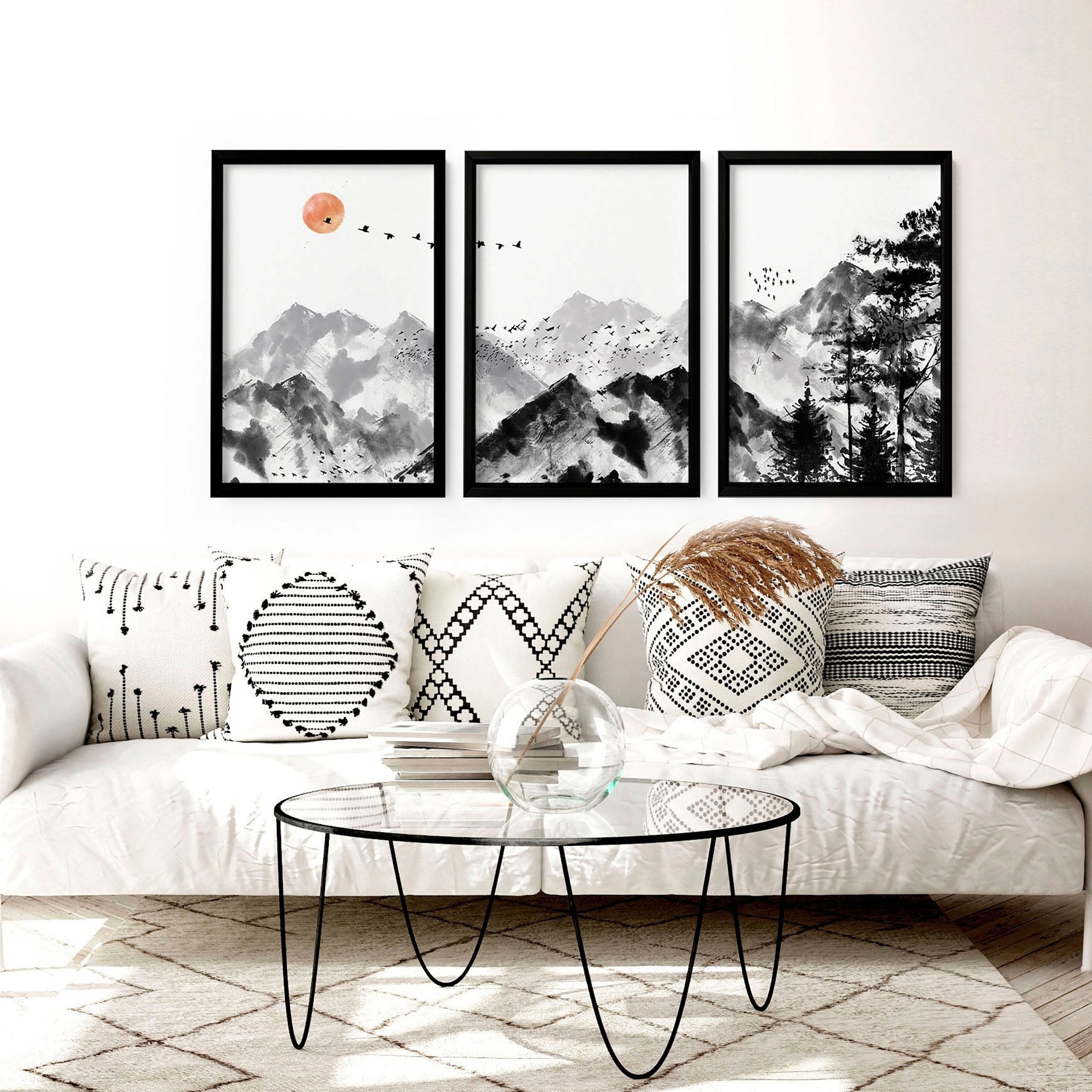 Set of 3 Scandi wall art prints featuring modern minimalist designs in grey, black, and white, elegantly framed.