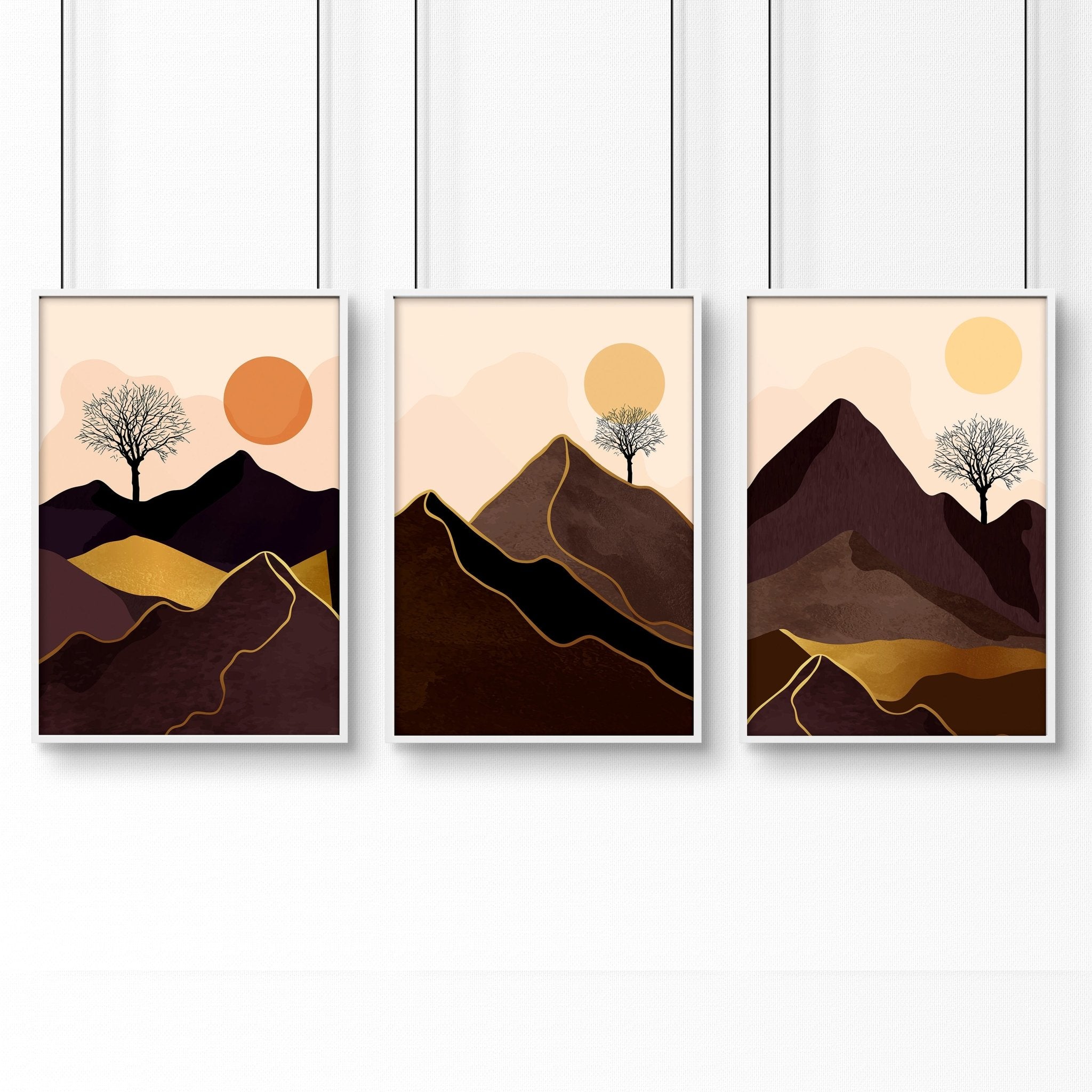 Set of 3 framed wall art prints featuring Scandinavian mountain landscapes in deep brown, blush, orange, and gold tones.
