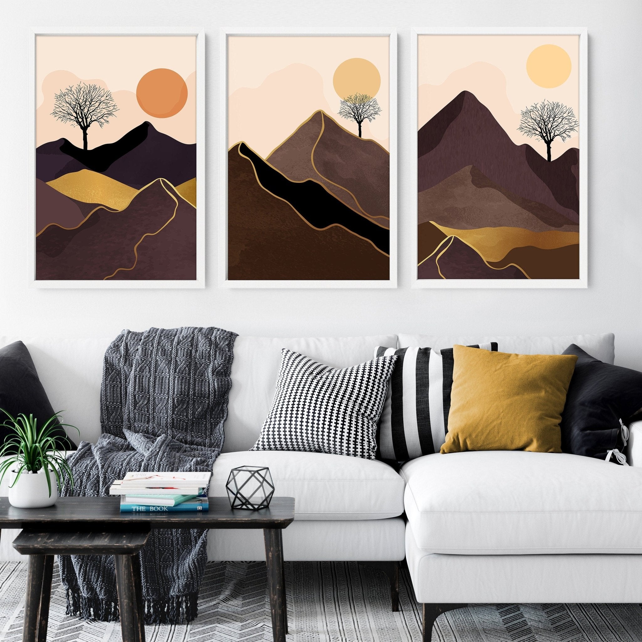 Set of 3 framed wall art prints featuring Scandinavian mountain landscapes in deep brown, blush, orange, and gold tones.