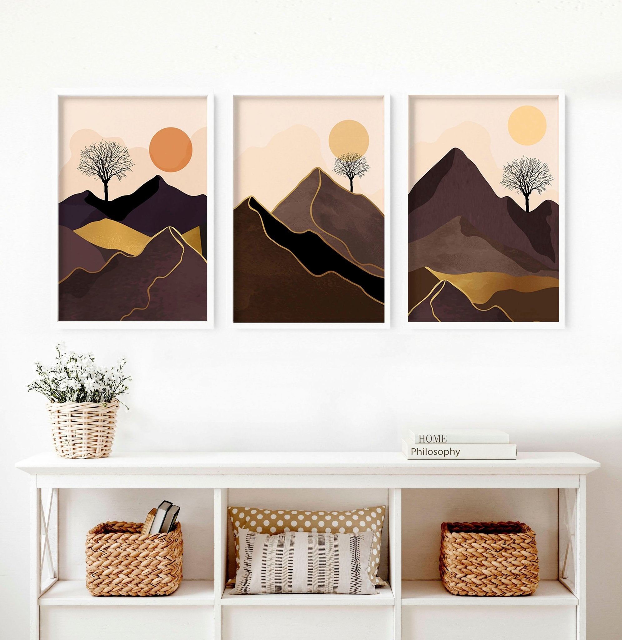 Set of 3 framed wall art prints featuring Scandinavian mountain landscapes in deep brown, blush, orange, and gold tones.