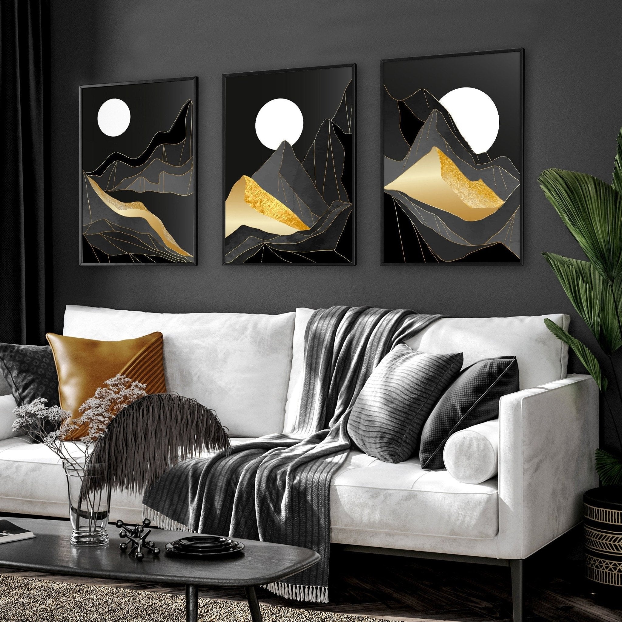 Set of 3 Scandinavian wall art prints featuring serene landscapes in black, grey, and gold, perfect for living room decor.