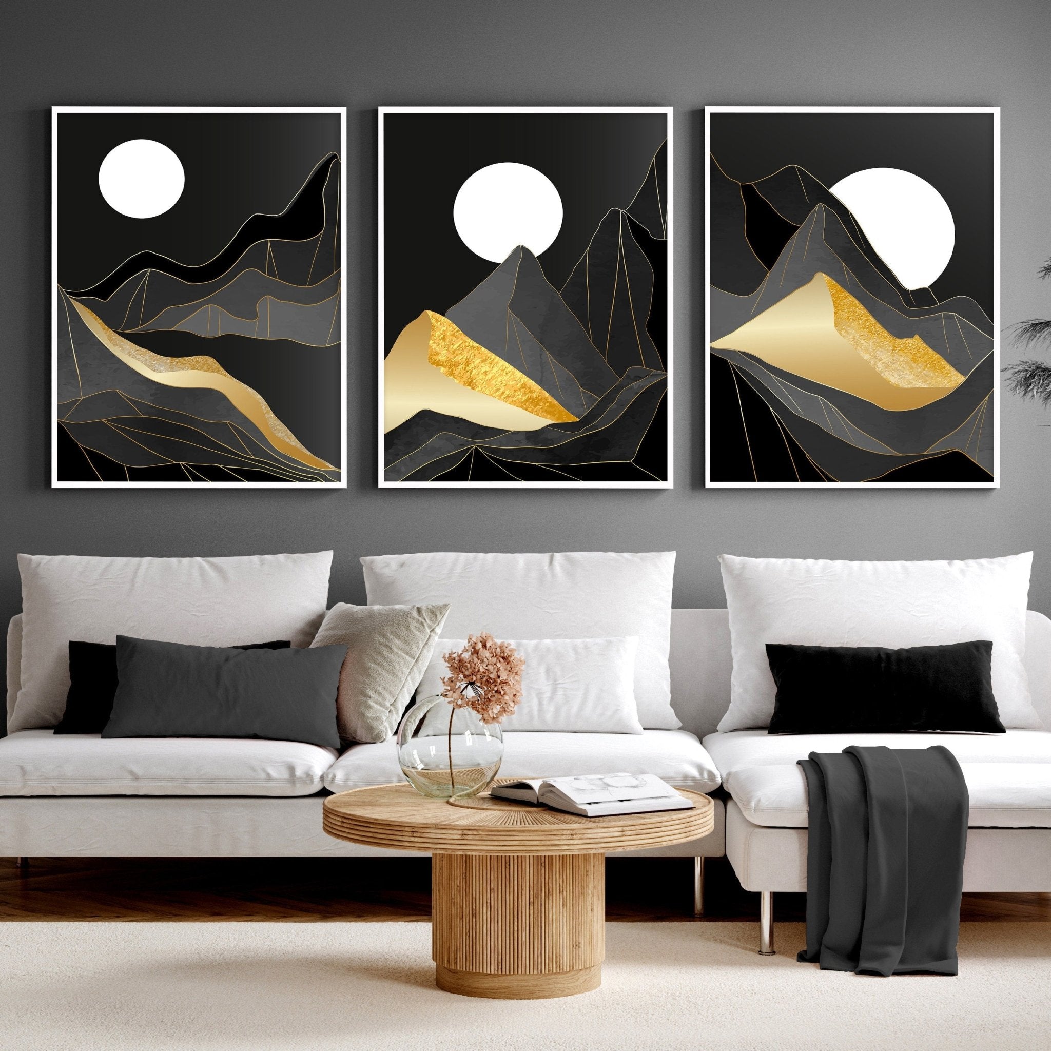 Set of 3 Scandinavian wall art prints featuring serene landscapes in black, grey, and gold, perfect for living room decor.