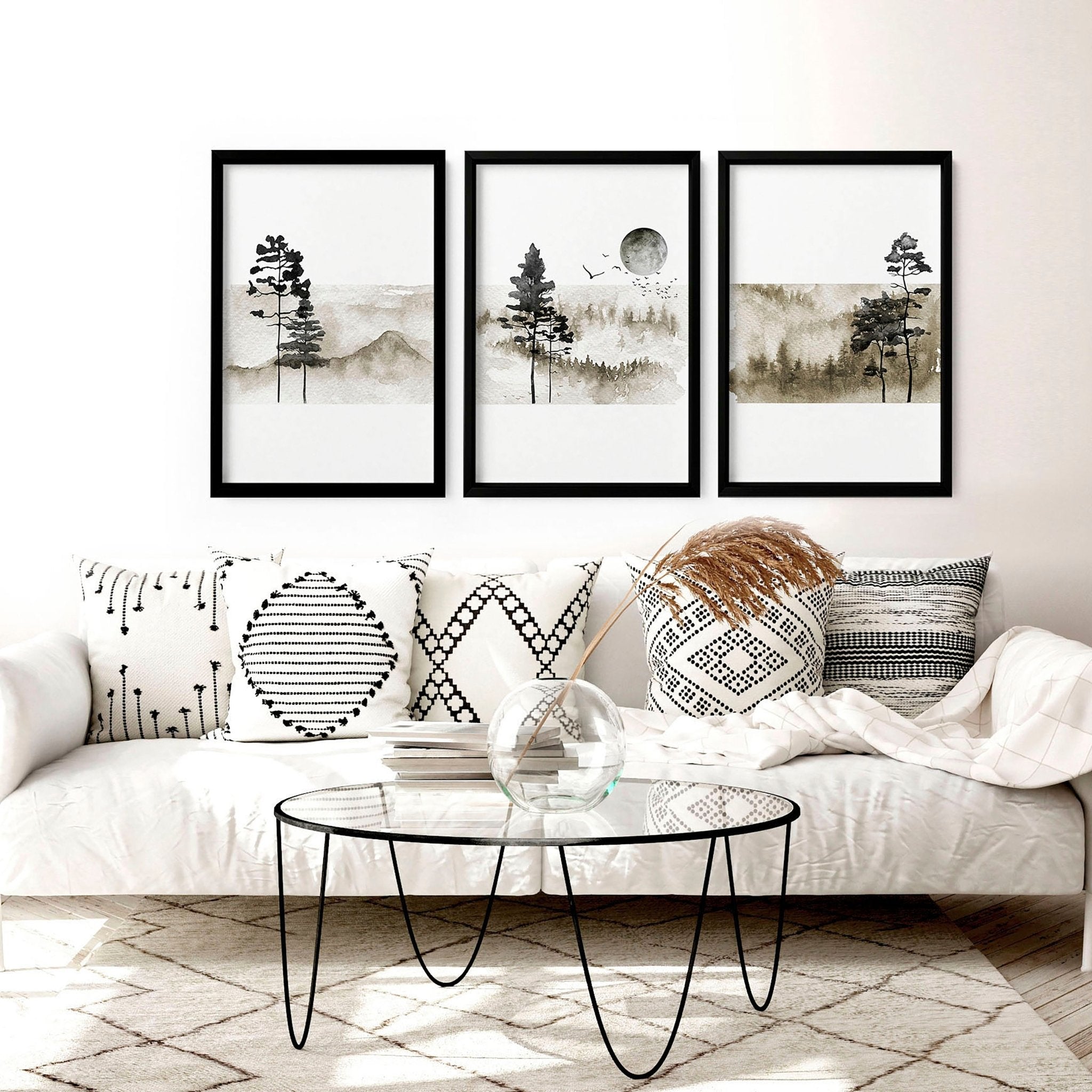 Set of 3 framed Scandinavian wall art prints featuring minimalist designs in black and white frames, perfect for modern home decor.