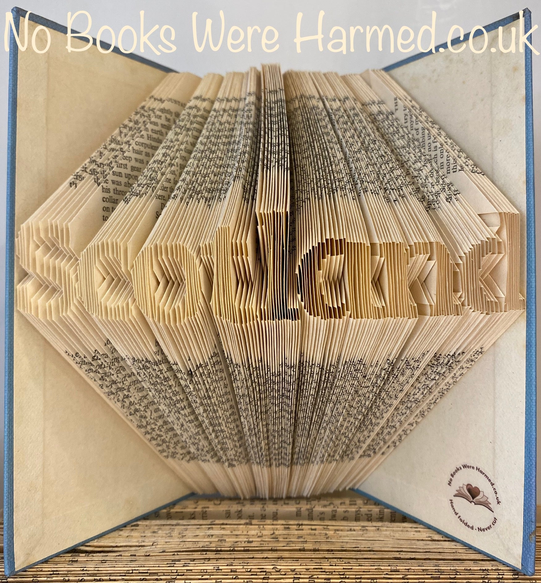 Handcrafted 'Scotland' style 4 book art made from vintage books, showcasing intricate hand-folded pages in a unique design.