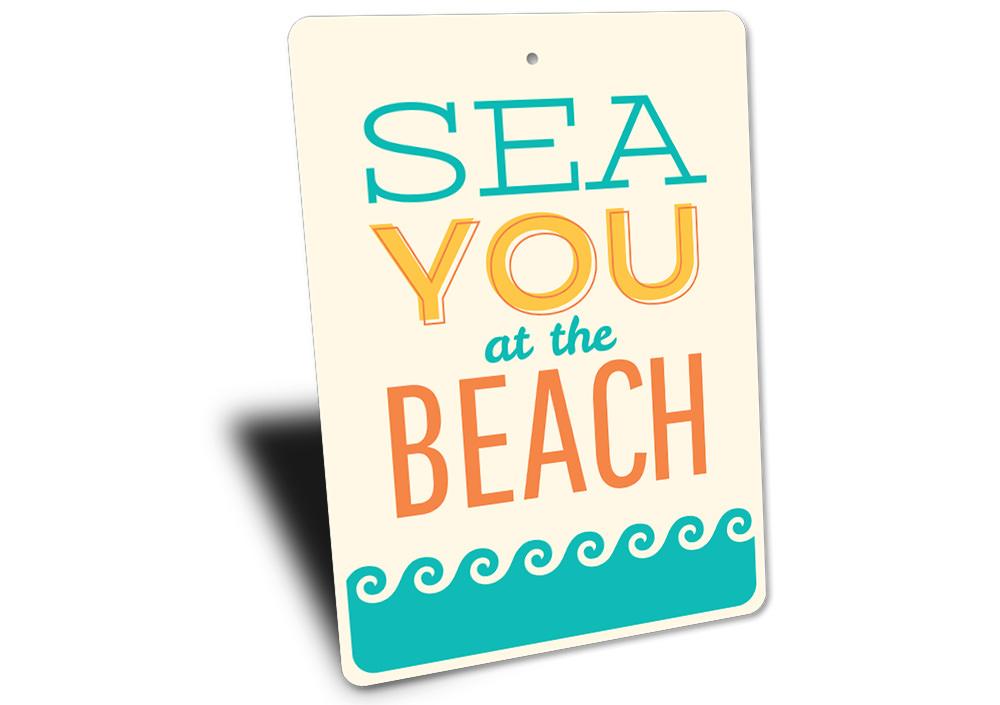 A vibrant See You At The Beach Sign made of durable aluminum, featuring beach-themed graphics and customizable text, perfect for home decor.