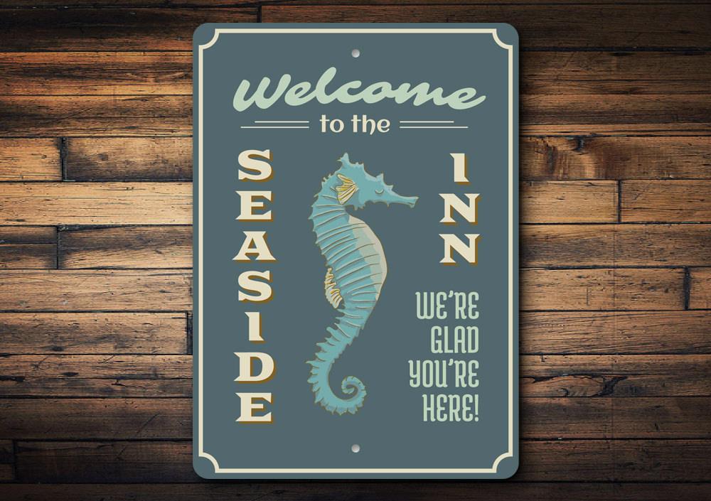 Seaside Inn Welcome Sign made of high-quality aluminum, featuring a beach-themed design perfect for coastal decor.