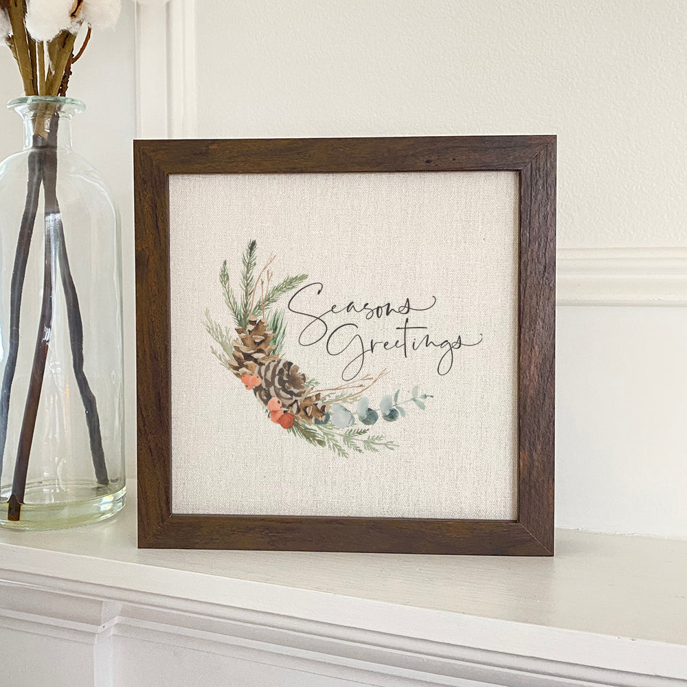 Seasons Greetings Swag - Framed Sign with a stylish wood frame and linen-look background, perfect for holiday decor.
