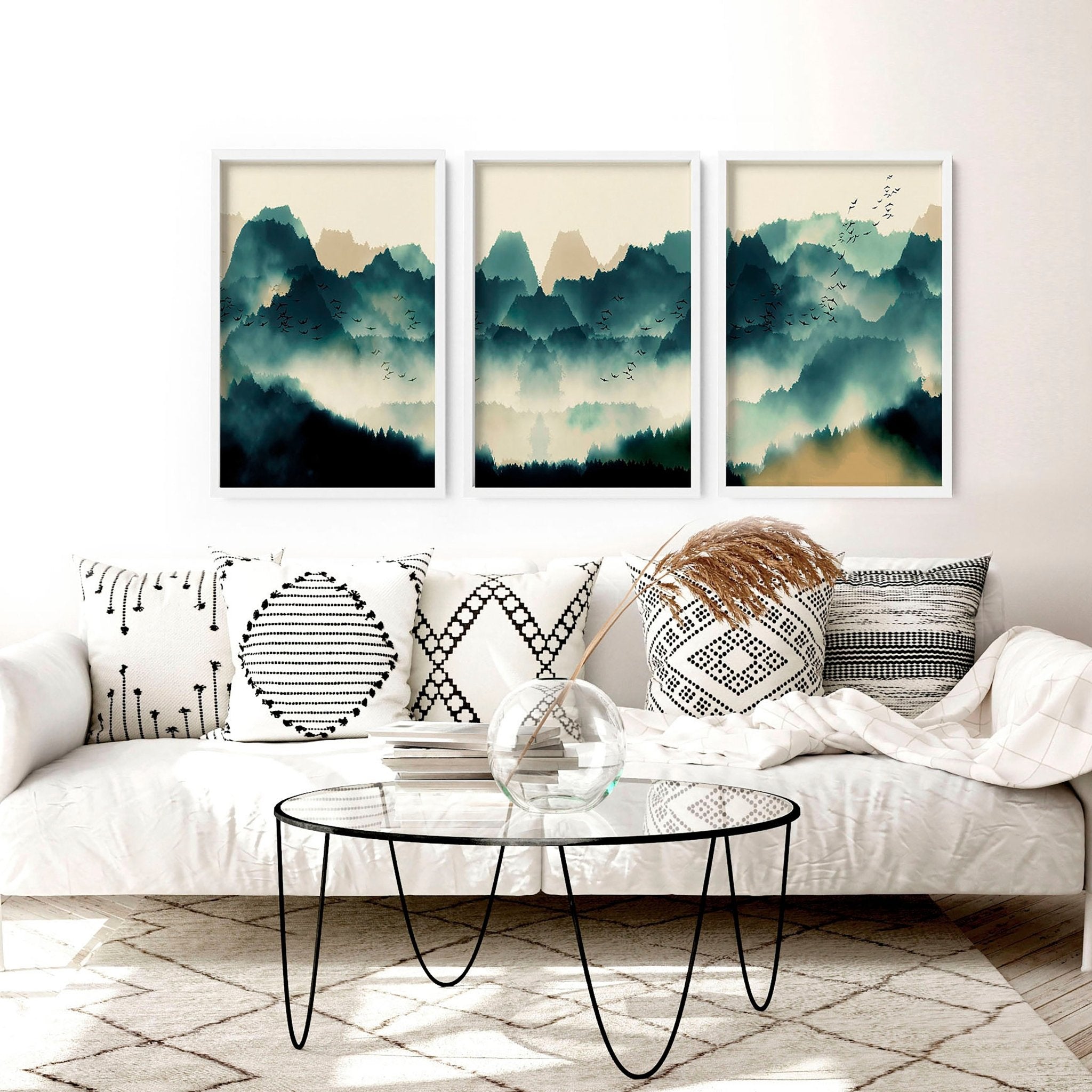 A set of 3 framed Scandinavian wall art prints featuring serene teal and beige landscapes, elegantly displayed in black or white frames.