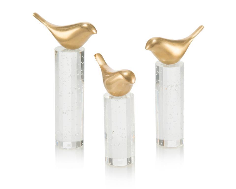 Set of three elegant brass birds perched on crystal rods, showcasing their unique design and craftsmanship.