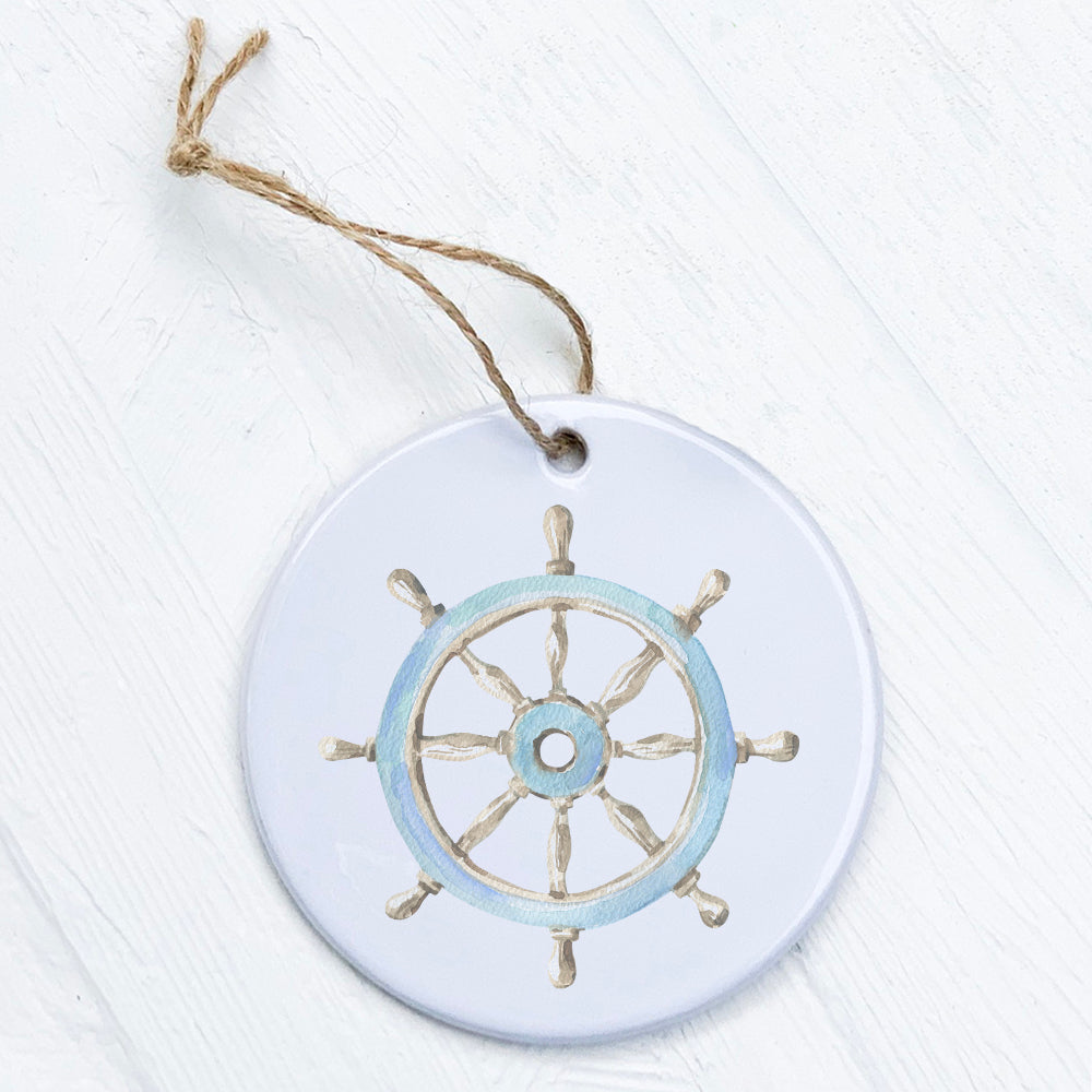 A beautifully crafted porcelain Ship Wheel Ornament featuring vibrant nautical designs, perfect for home decor or gifting.