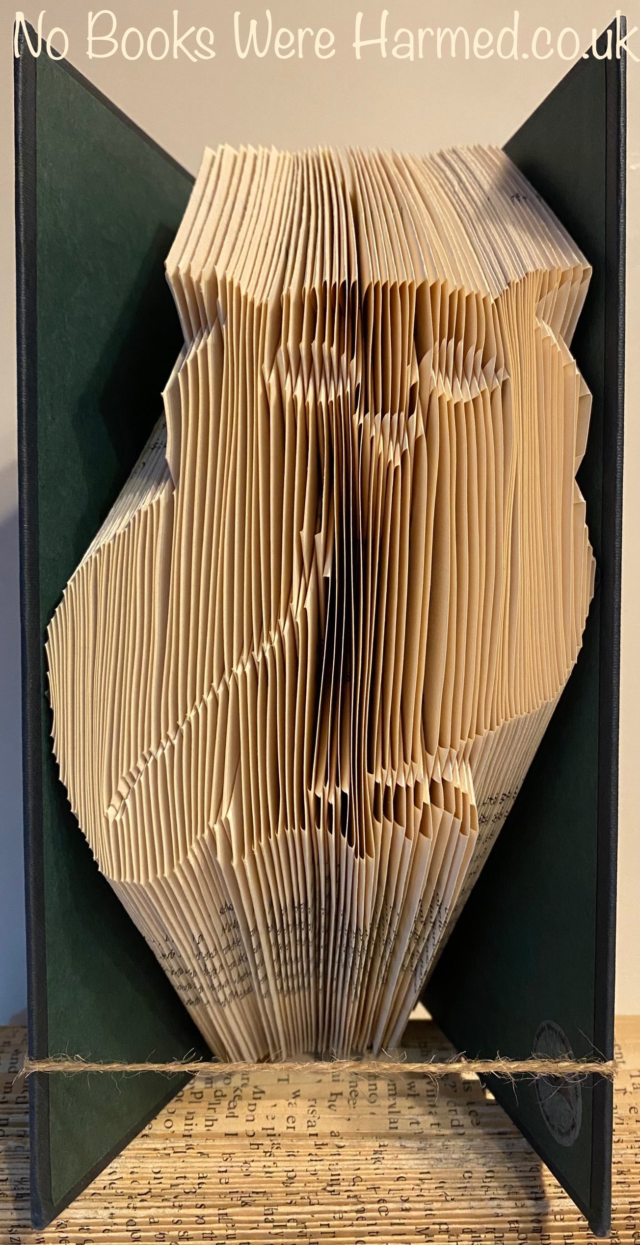 Handcrafted Side on Owl art piece made from vintage book pages, showcasing intricate folds and unique design.