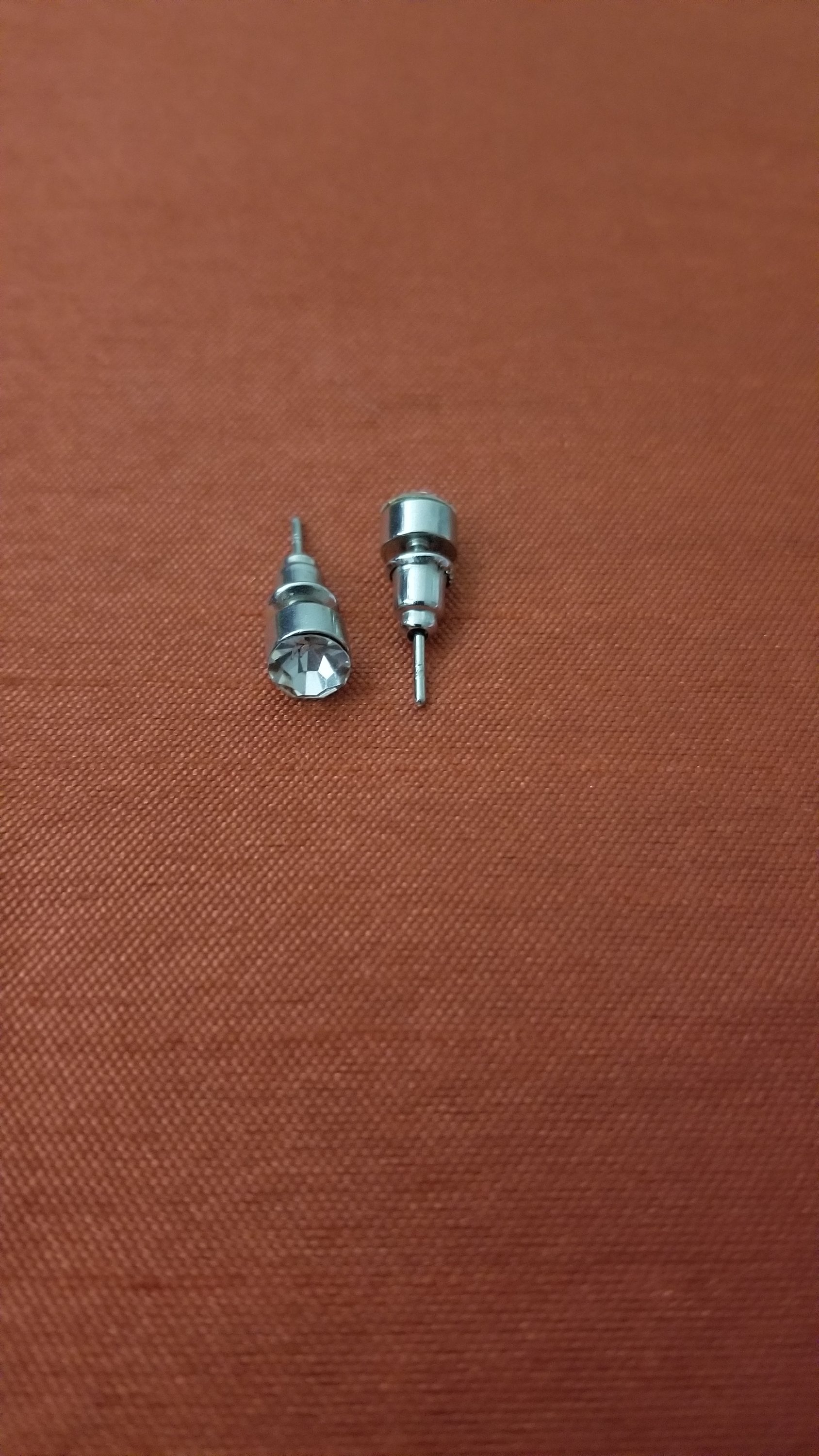 Single Sparkly Stone Ear Stud featuring a white crystal on a silver stud, perfect for everyday wear.