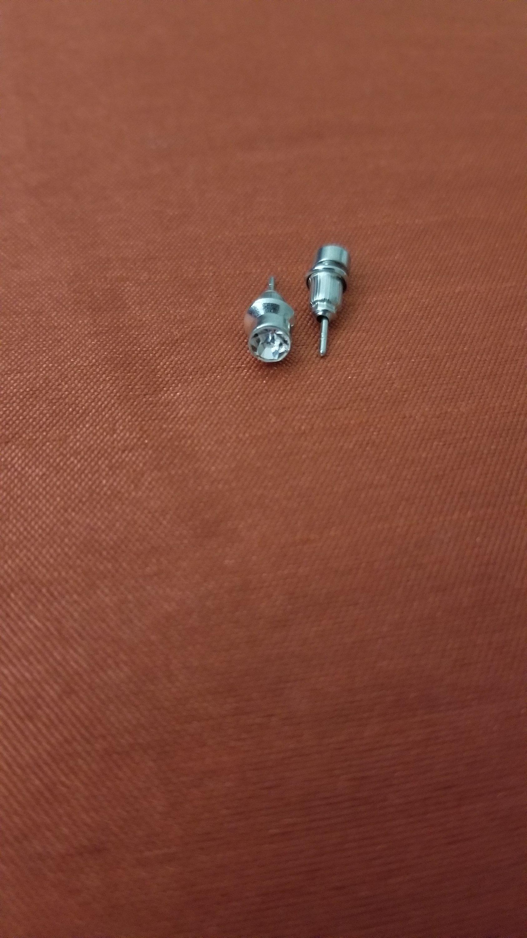 Single Sparkly Stone Ear Stud featuring a white crystal on a silver stud, perfect for everyday wear.