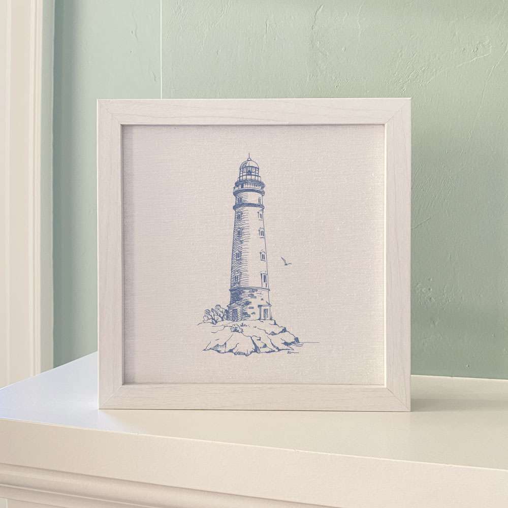 A round framed sign featuring a sketched lighthouse design, with a natural wood frame available in walnut or white-washed finish.