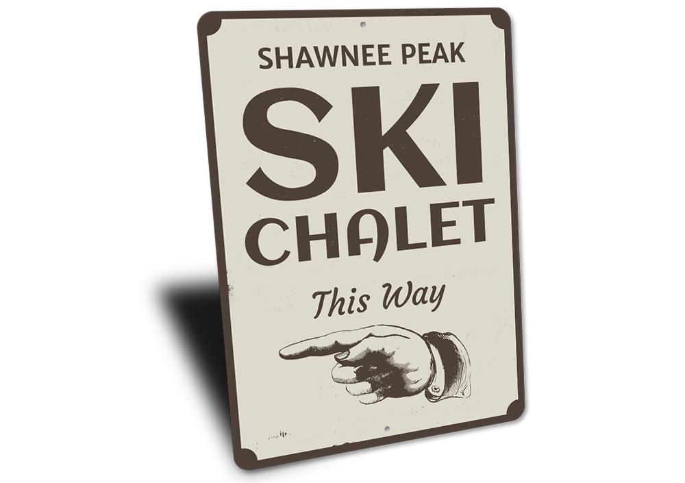 A decorative Ski Chalet This Way Sign made of high-quality aluminum, featuring customizable text options, ideal for ski lovers and lodge decor.