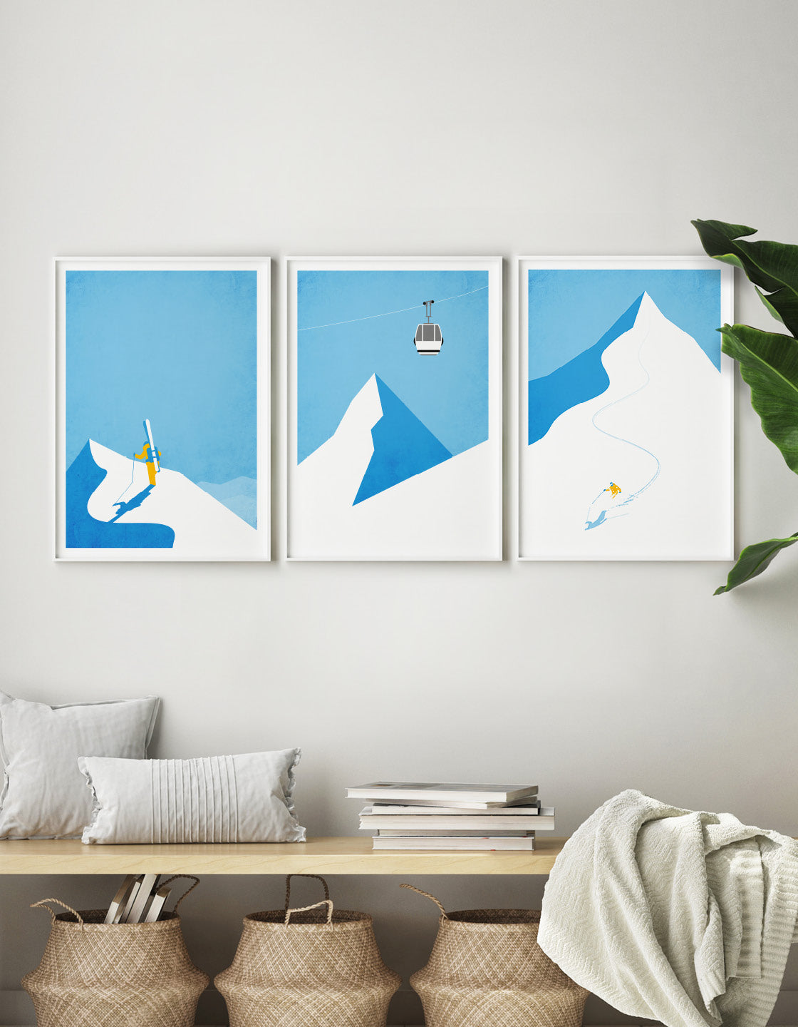 A modern ski gallery wall featuring minimalist ski art prints in various frames, showcasing winter landscapes and skiing themes.