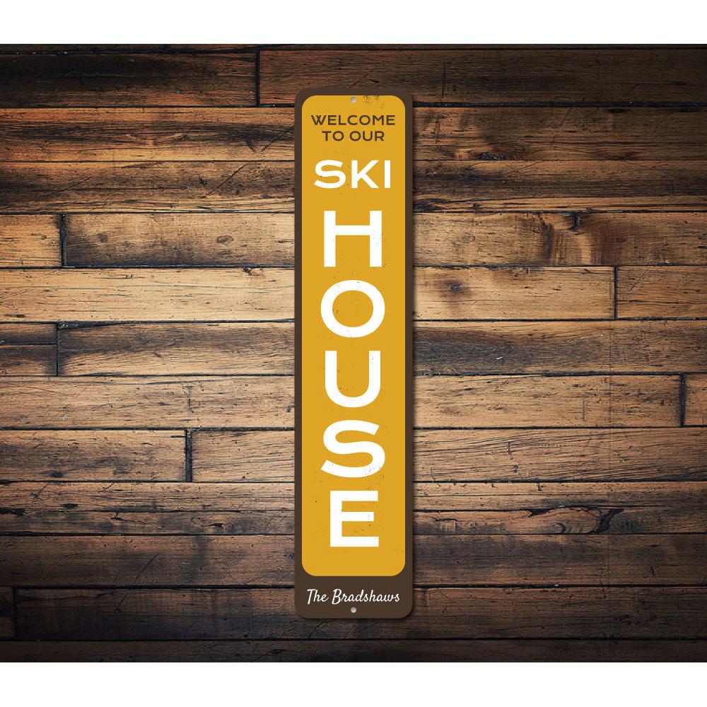 Ski House Vertical Sign made of aluminum, featuring customizable text and a rustic design, perfect for ski enthusiasts.