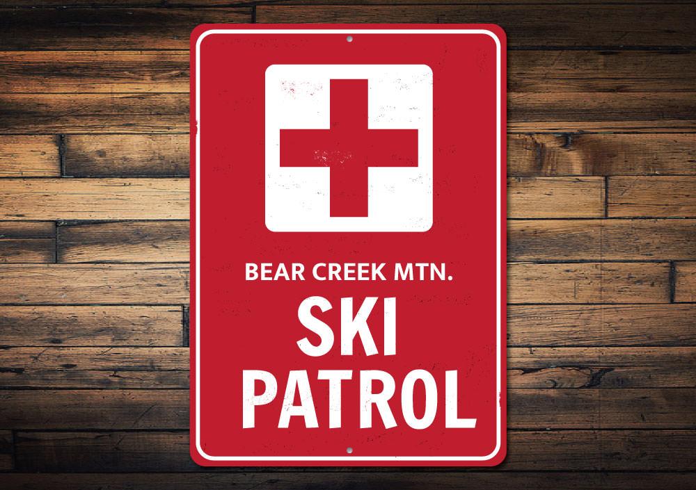 Ski Patrol Cross Sign made of high-quality aluminum, featuring customizable text and pre-drilled holes for easy mounting.