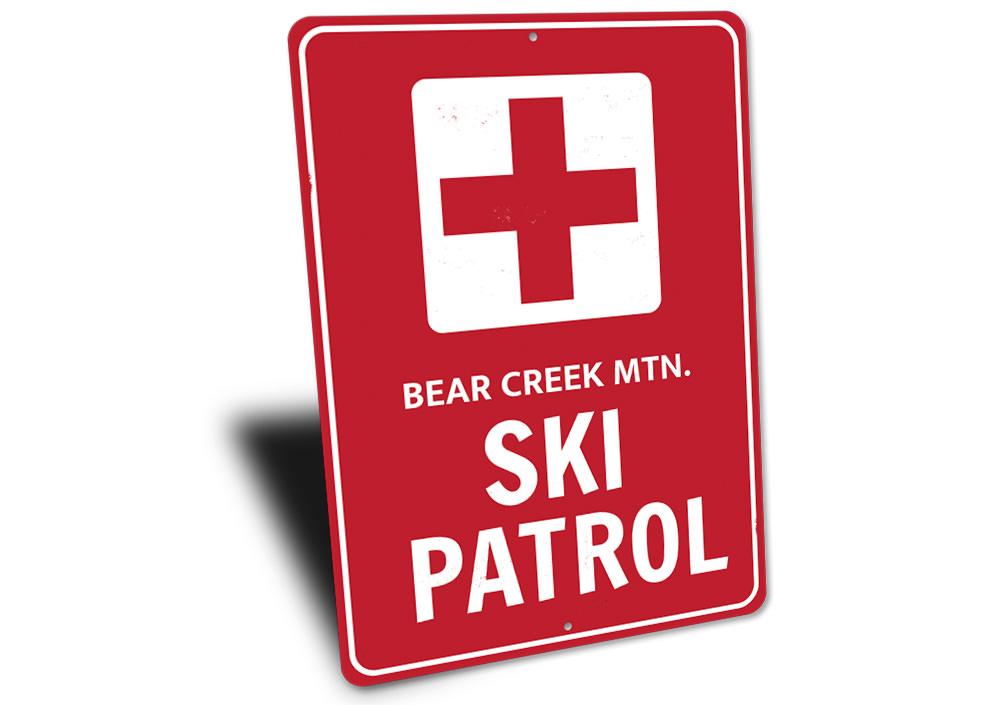 Ski Patrol Cross Sign made of high-quality aluminum, featuring customizable text and pre-drilled holes for easy mounting.