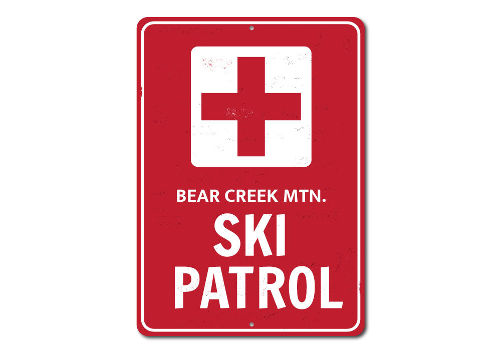 Ski Patrol Cross Sign made of high-quality aluminum, featuring customizable text and pre-drilled holes for easy mounting.