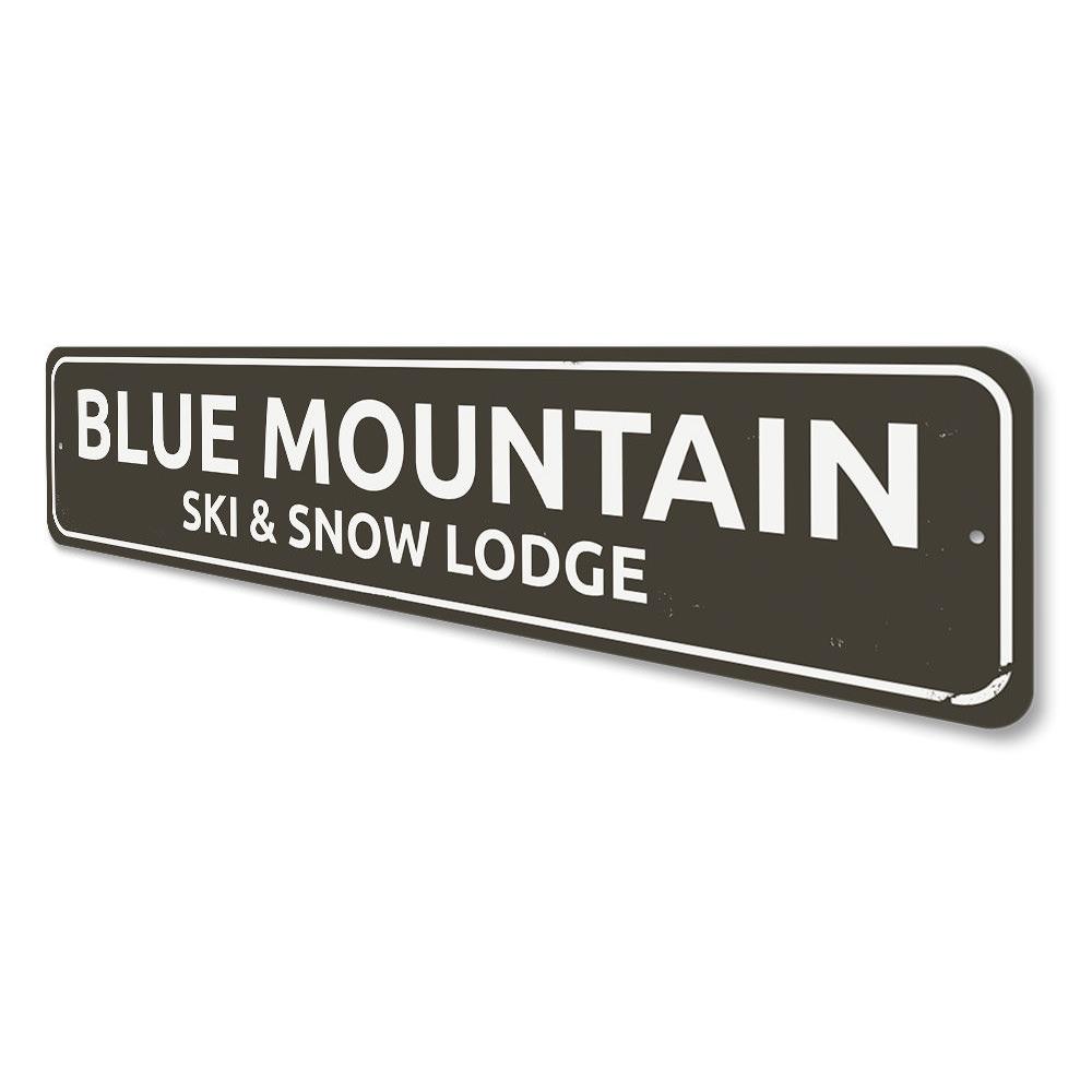 A decorative Ski & Snow Lodge Sign made of high-quality aluminum, featuring customizable text and pre-drilled holes for easy mounting.