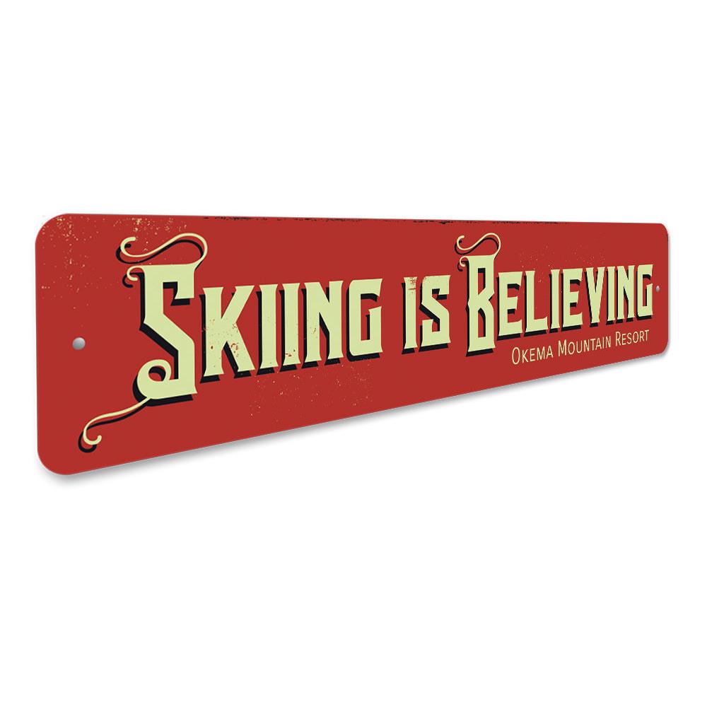 Skiing is Believing decorative sign made of aluminum, featuring a vibrant design perfect for ski enthusiasts.