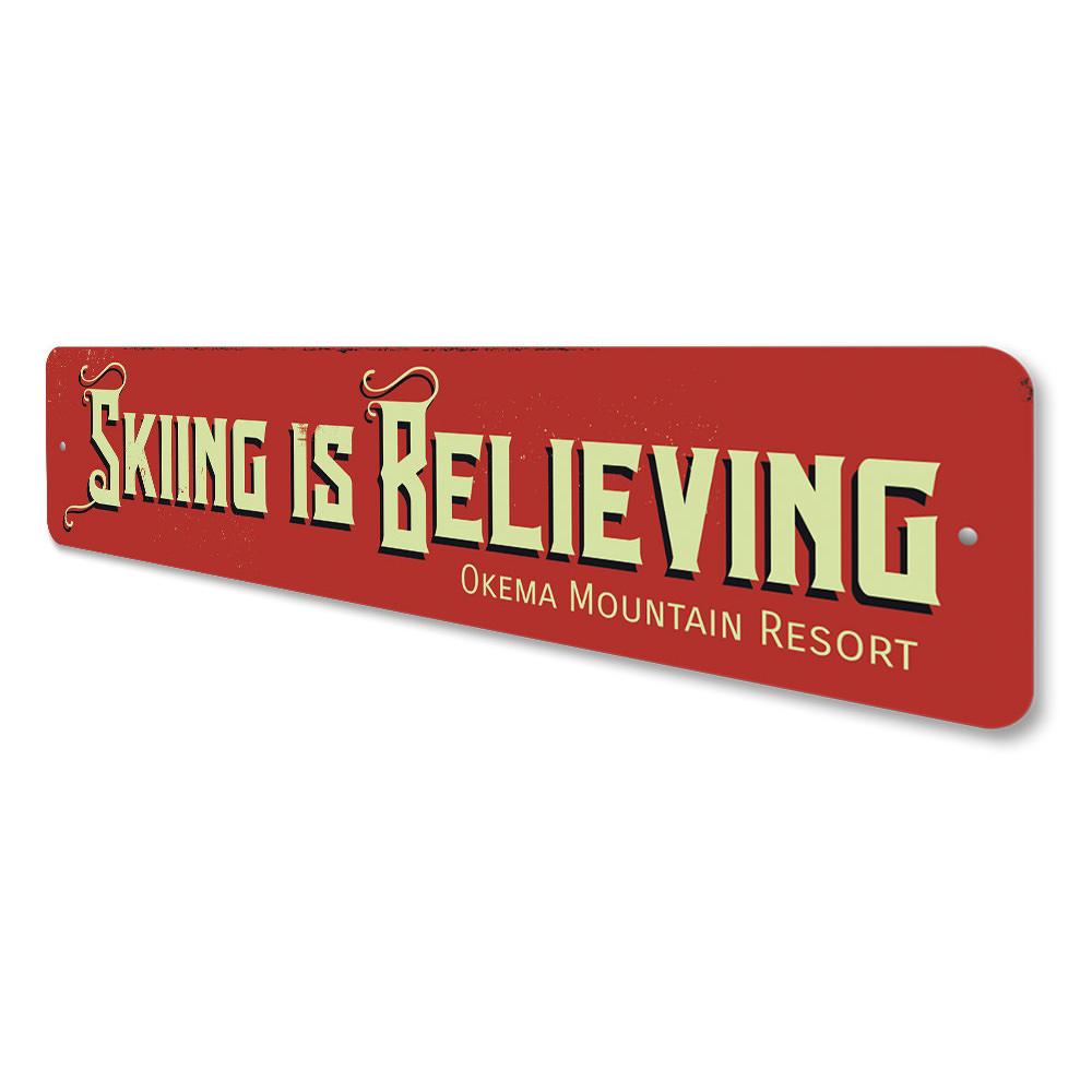 Skiing is Believing decorative sign made of aluminum, featuring a vibrant design perfect for ski enthusiasts.