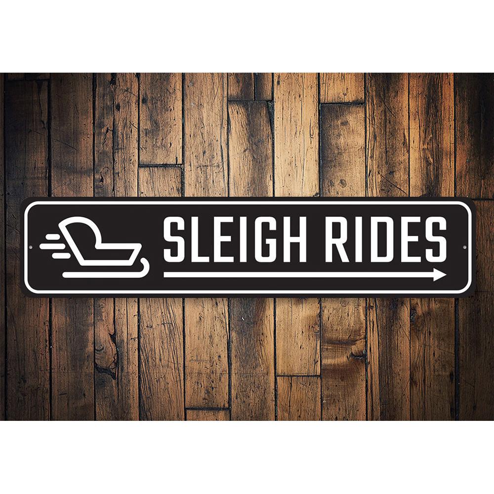 A festive Sleigh Rides This Way sign made of durable aluminum, featuring vibrant colors and a charming design perfect for holiday decor.