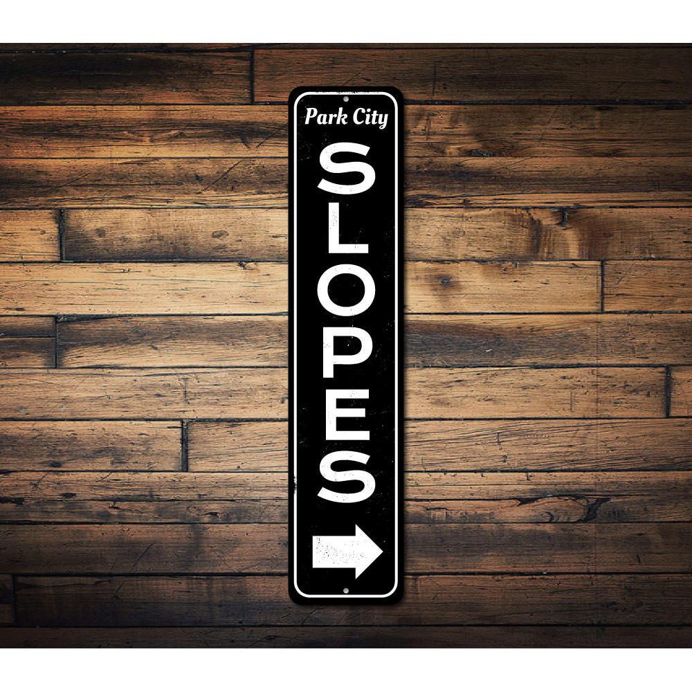 Slopes Arrow Vertical Sign made of high-quality aluminum, featuring a ski-themed design perfect for home decor.