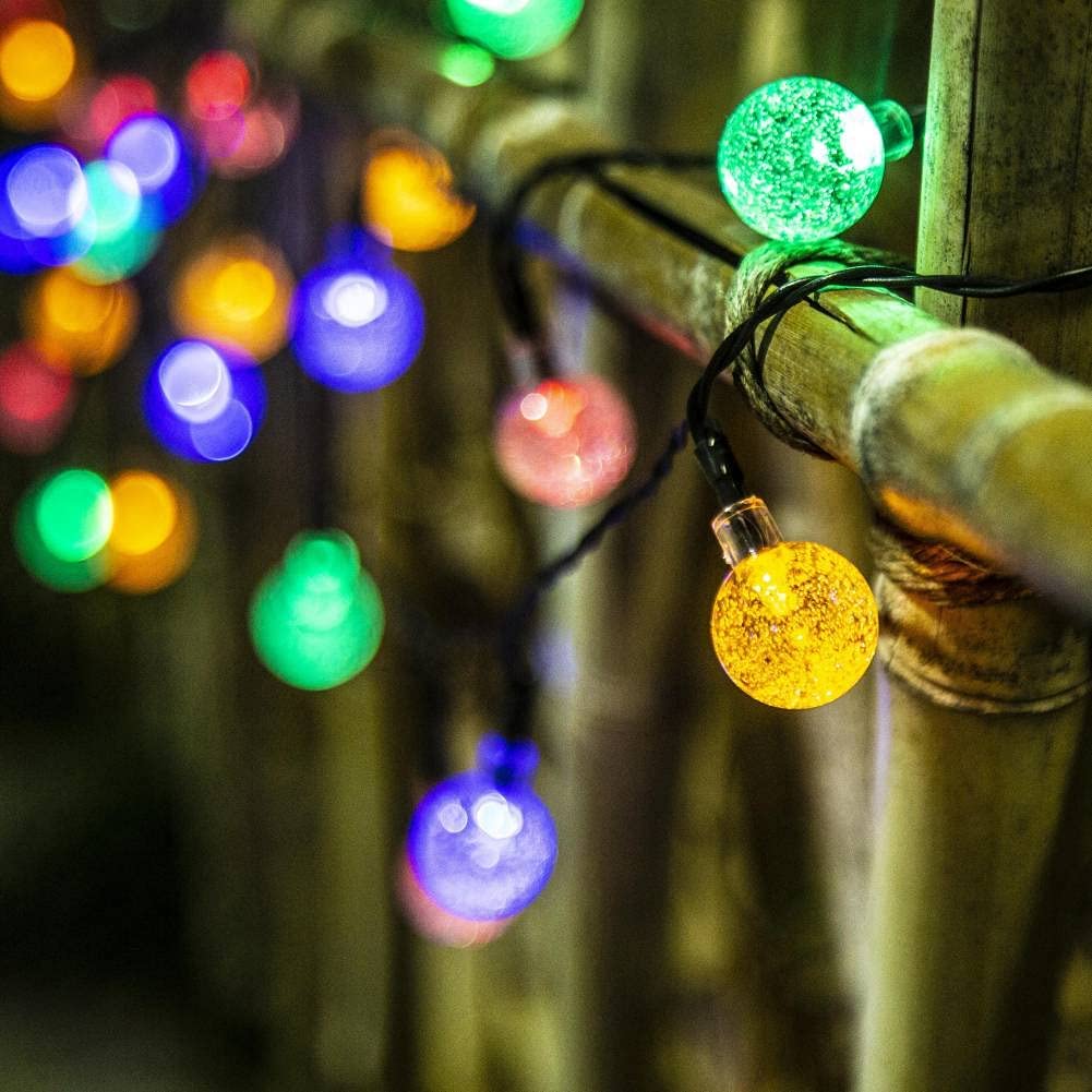 Solar 100LED Crystal Globe Lights with colorful bubble crystal balls, perfect for outdoor decoration during festive occasions.