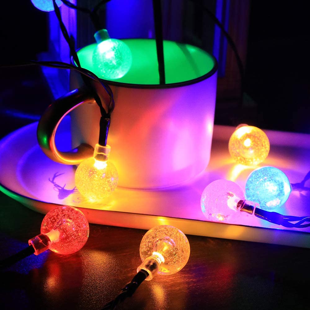 Solar 100LED Crystal Globe Lights with colorful bubble crystal balls, perfect for outdoor decoration during festive occasions.