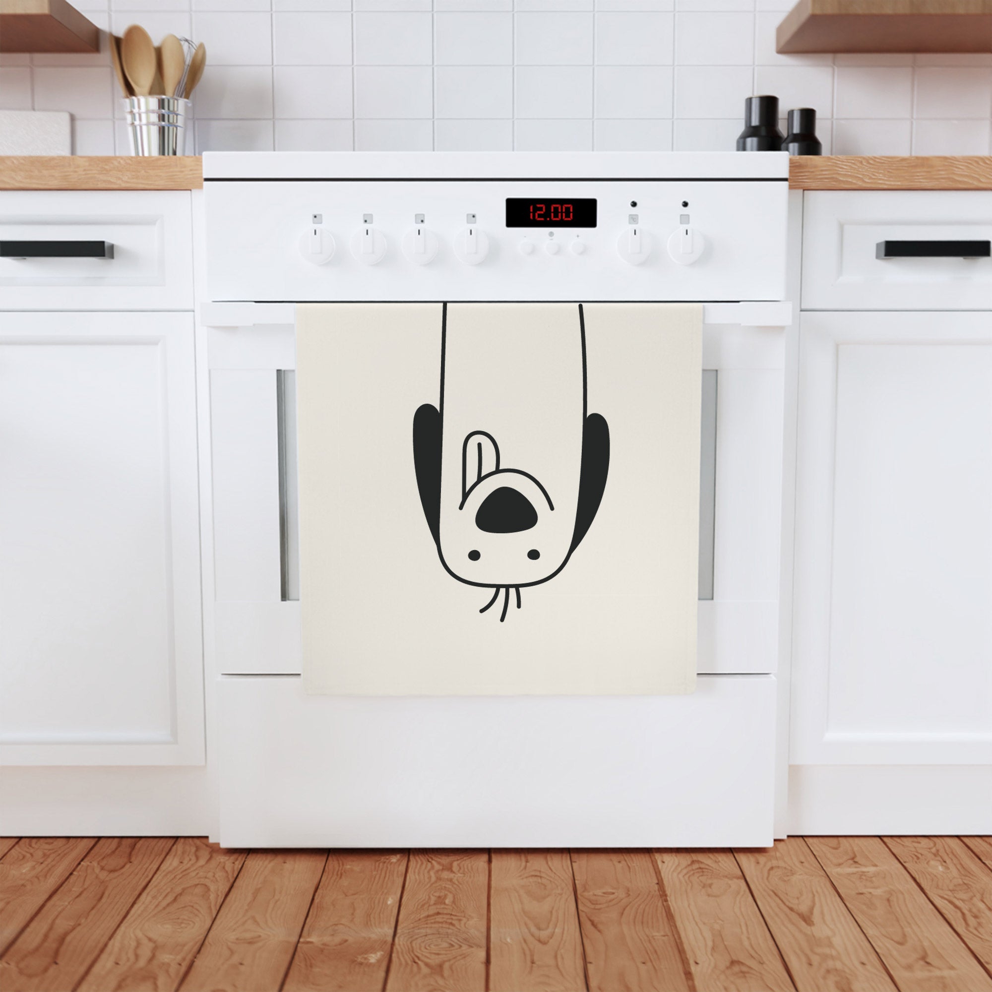 A charming Spaniel dog printed on a soft, organic cotton tea towel, measuring 50 x 70 cm, perfect for kitchen or bathroom use.