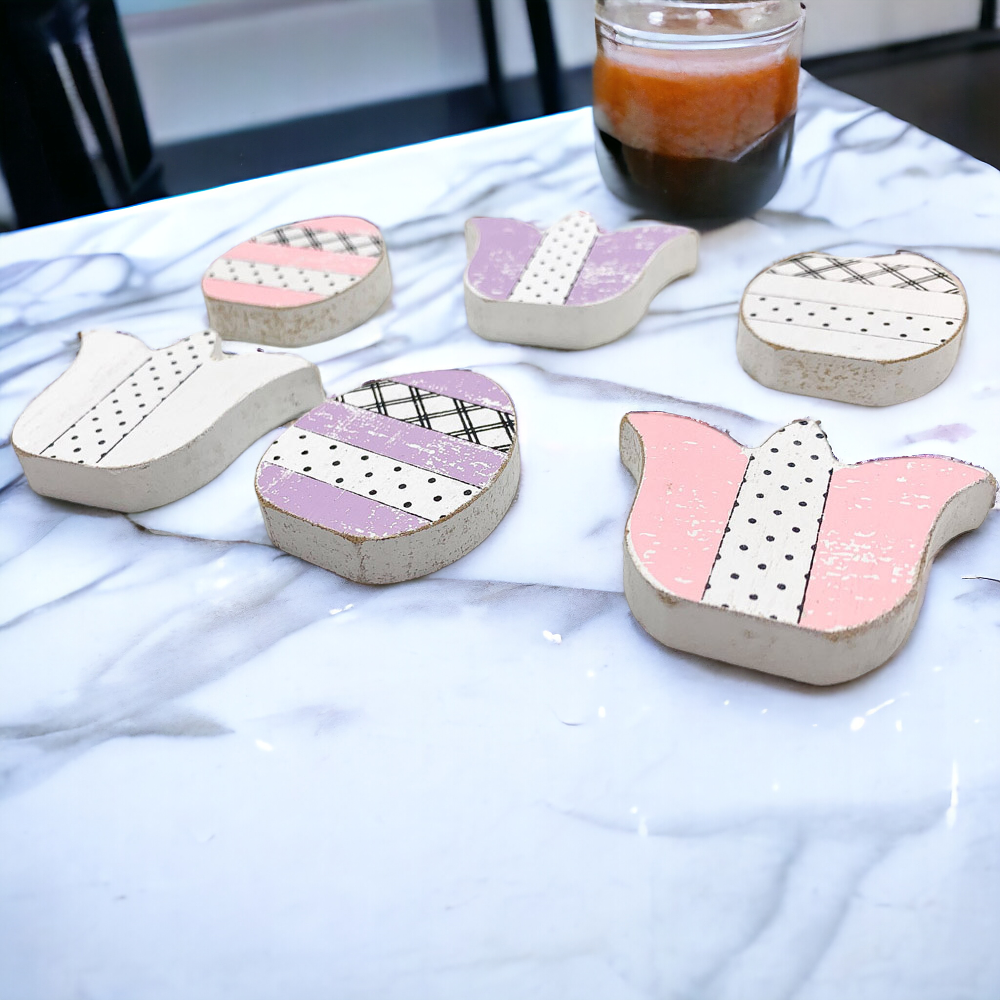 A set of handmade wooden spring accents including tulips and Easter eggs in purple, white, and pink, perfect for seasonal decor.