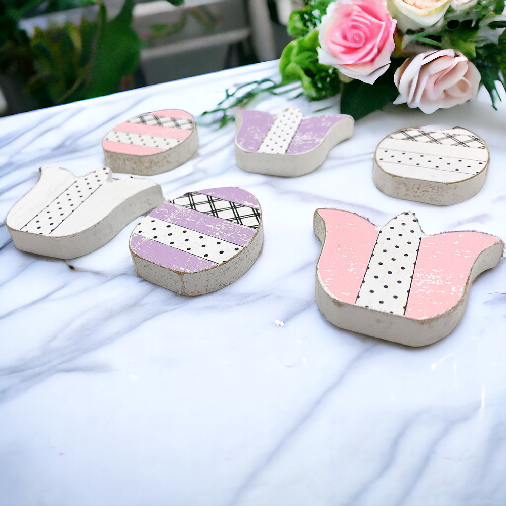 A set of handmade wooden spring accents including tulips and Easter eggs in purple, white, and pink, perfect for seasonal decor.