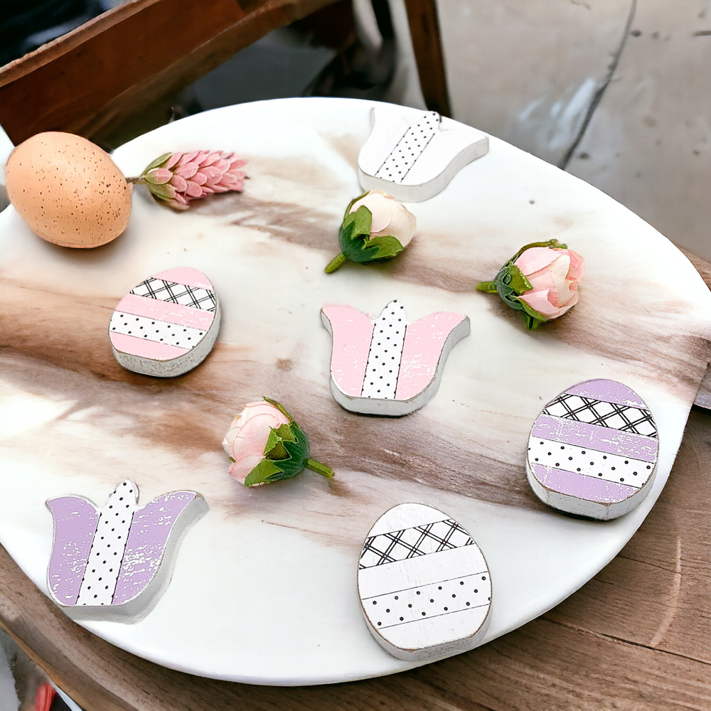 A set of handmade wooden spring accents including tulips and Easter eggs in purple, white, and pink, perfect for seasonal decor.
