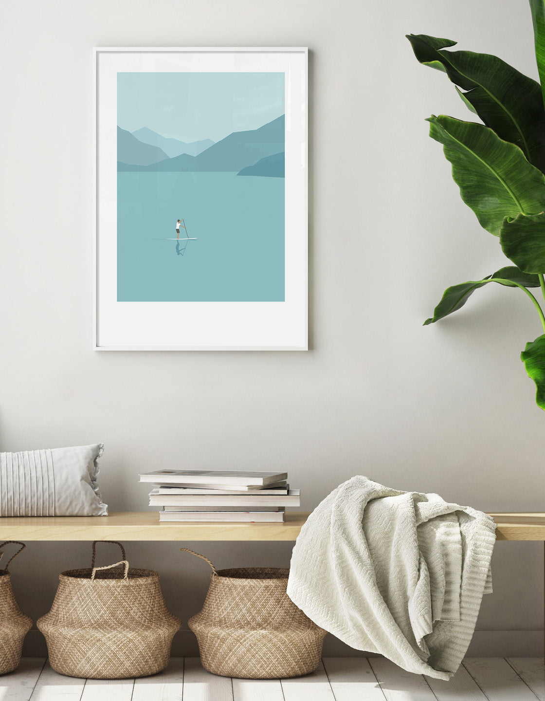 A minimalist art print featuring a stand up paddleboarder on calm blue waters, perfect for home decor.