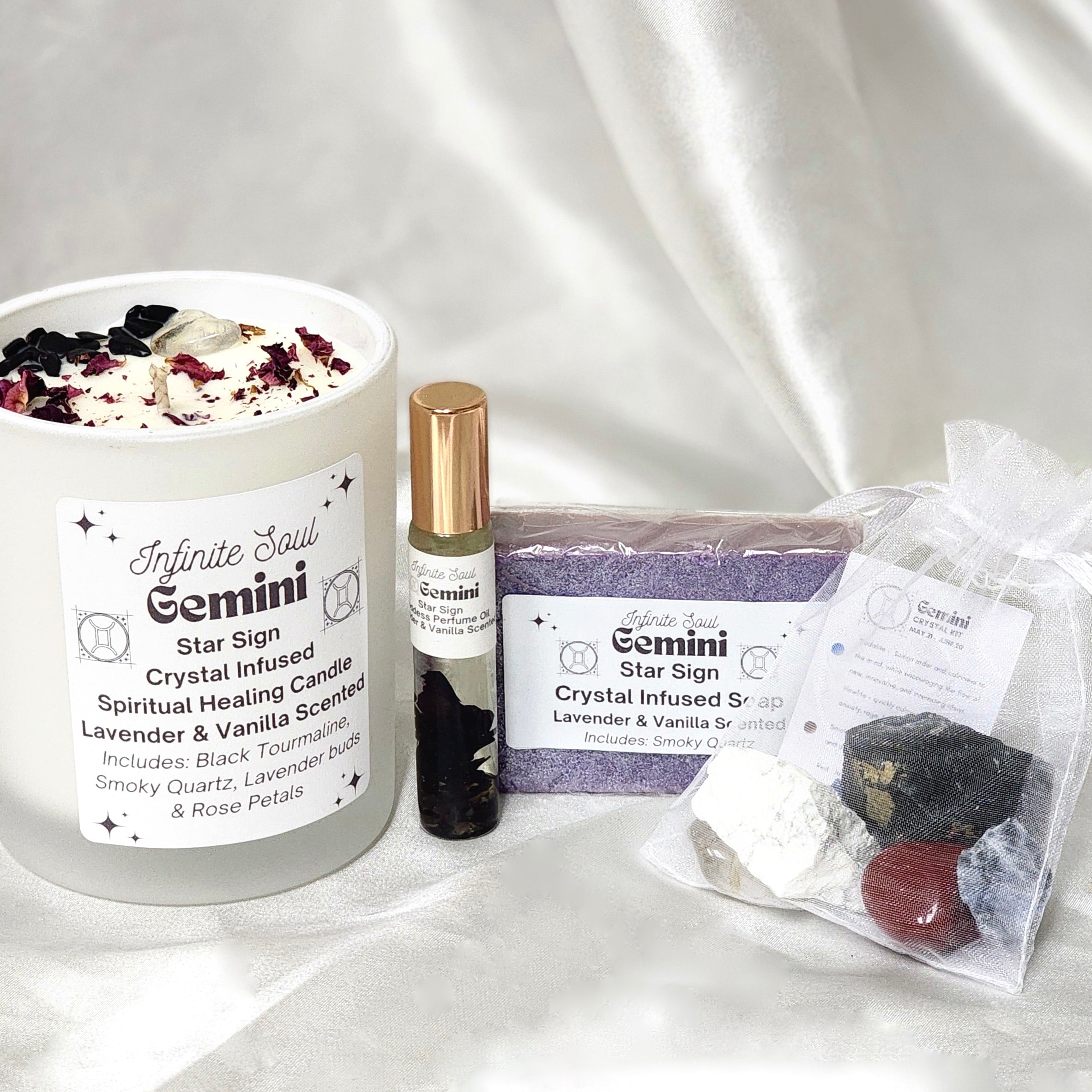 The Gemini Collection featuring a spiritual healing candle, goddess perfume oil, and crystal healing kit, all designed for Gemini individuals.
