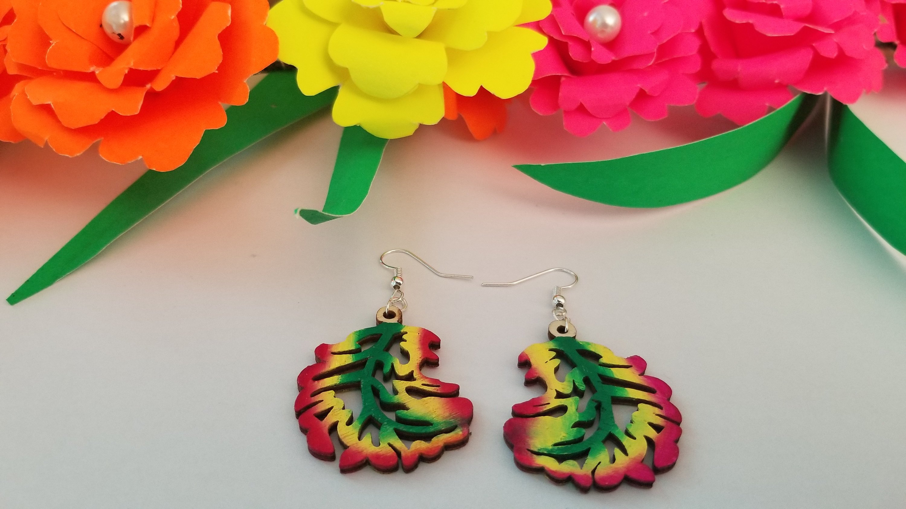 Handmade wooden autumn leaf earrings with stainless steel ear wire, showcasing intricate leaf design and vibrant colors.