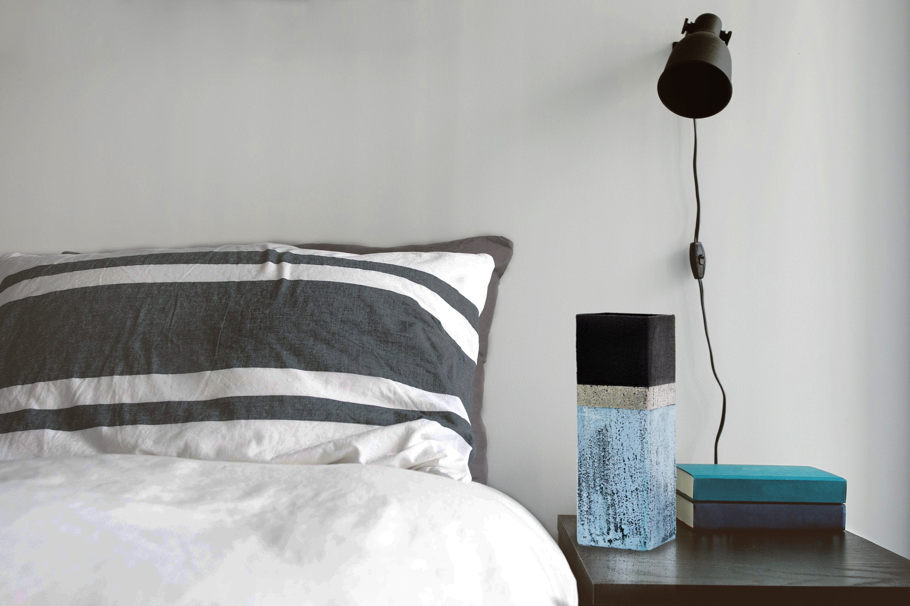 A beautifully hand-painted stone imitation glass vase, showcasing unique designs and vibrant colors, perfect for table decor.