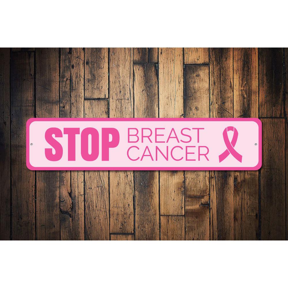 A decorative Stop Breast Cancer Sign made of aluminum, featuring a pink ribbon design, perfect for home decor and raising awareness.