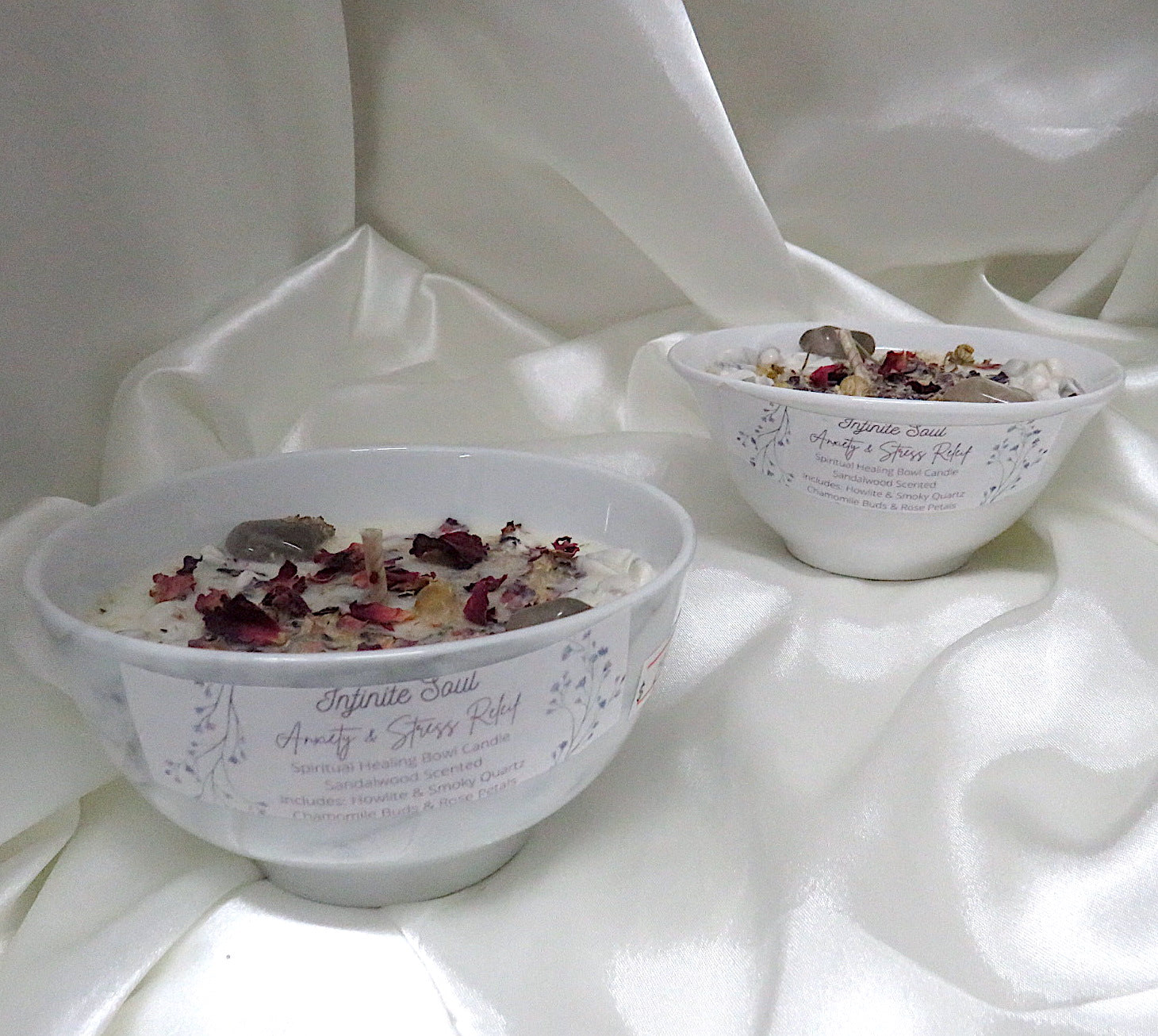 Stress Less Crystal Infused Bowl Candle with sandalwood scent, featuring Howlite and Smoky Quartz crystals, adorned with rose petals and chamomile buds.