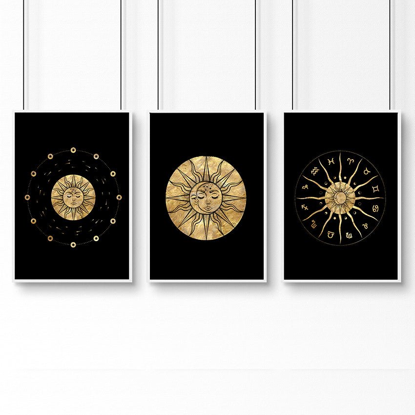 Set of three framed wall art prints featuring intricate sun and moon designs in a radiant gold finish, perfect for bohemian decor.