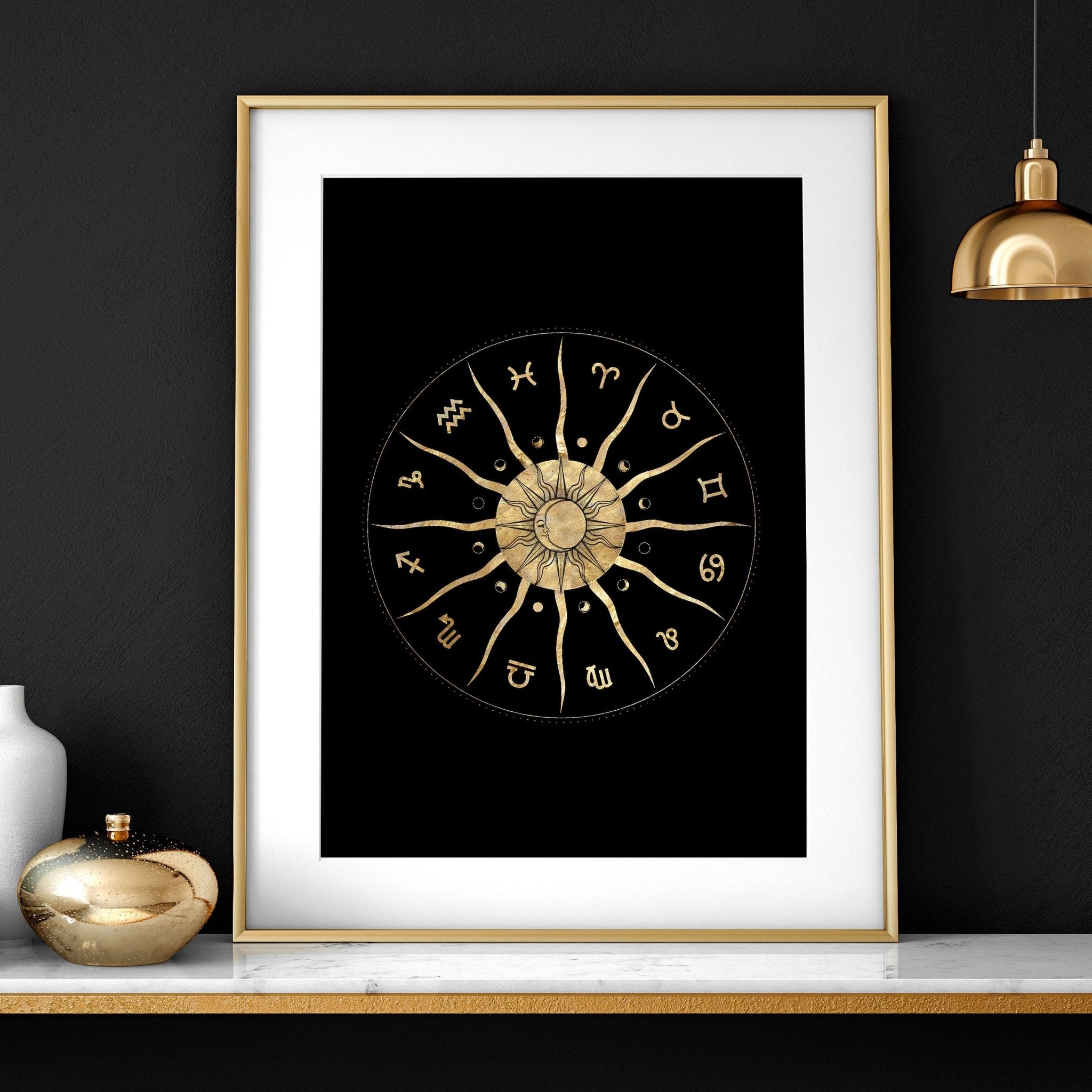 Set of three framed wall art prints featuring intricate sun and moon designs in a radiant gold finish, perfect for bohemian decor.