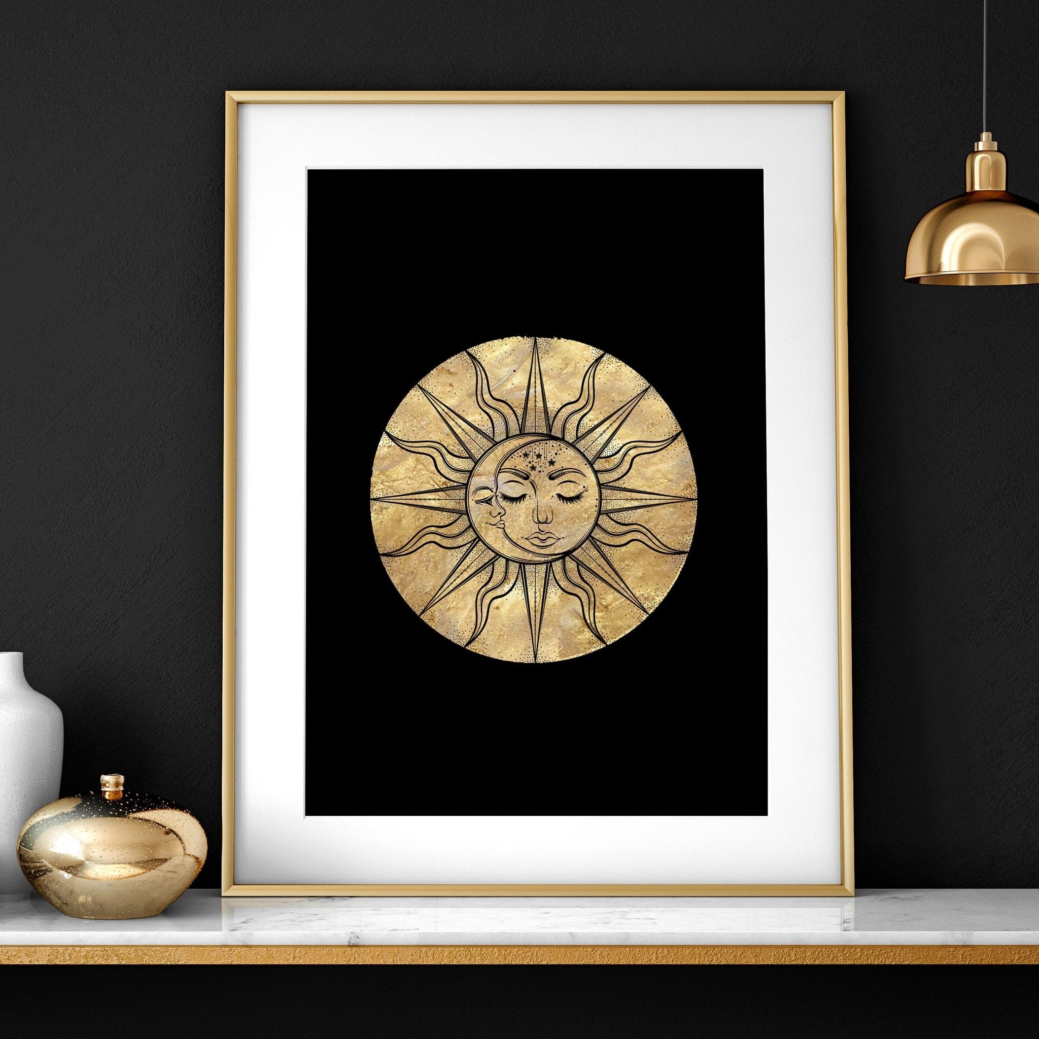 Set of three framed wall art prints featuring intricate sun and moon designs in a radiant gold finish, perfect for bohemian decor.