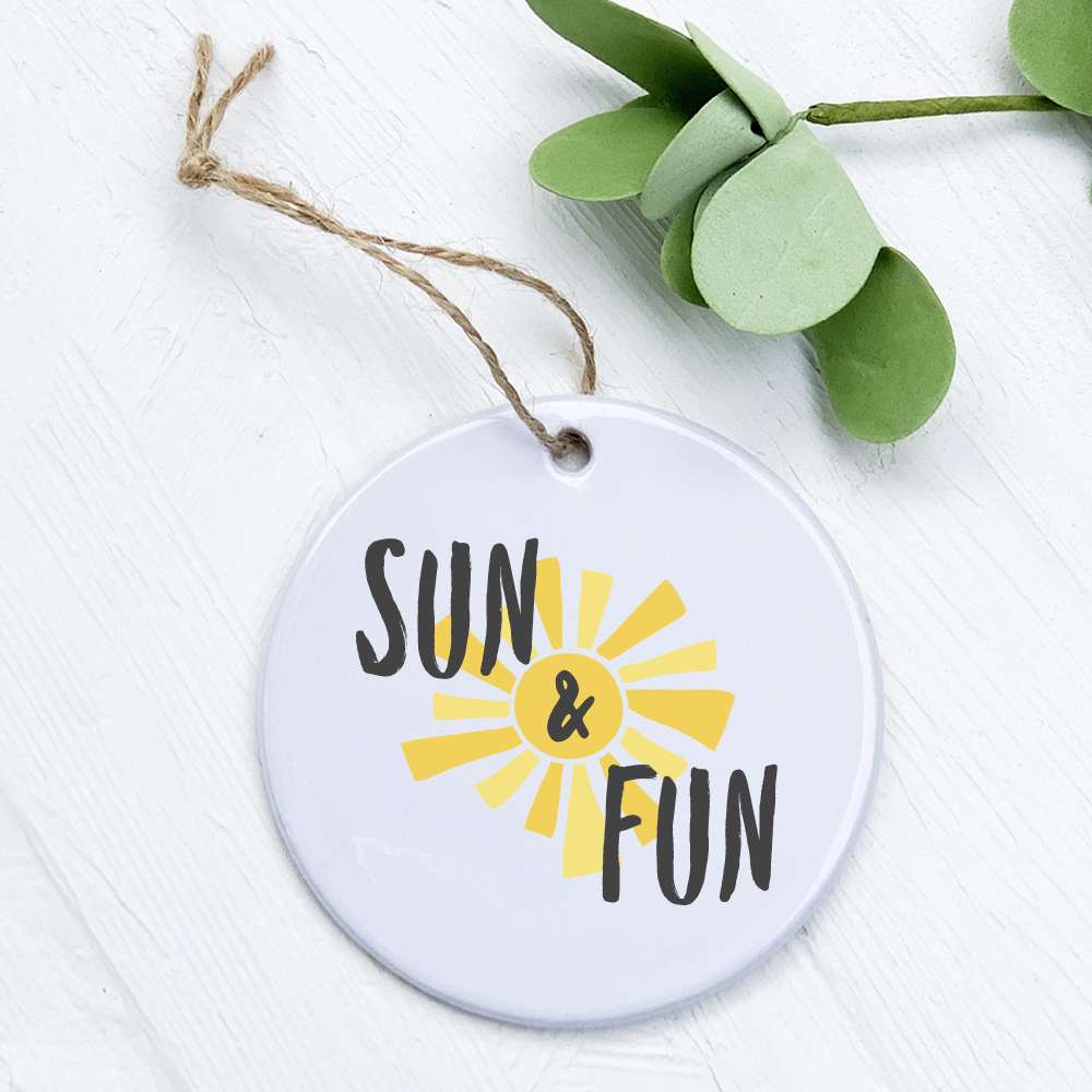 Sun & Fun porcelain ornament featuring original designs, 2.75 inches in diameter, with a smooth gloss finish.