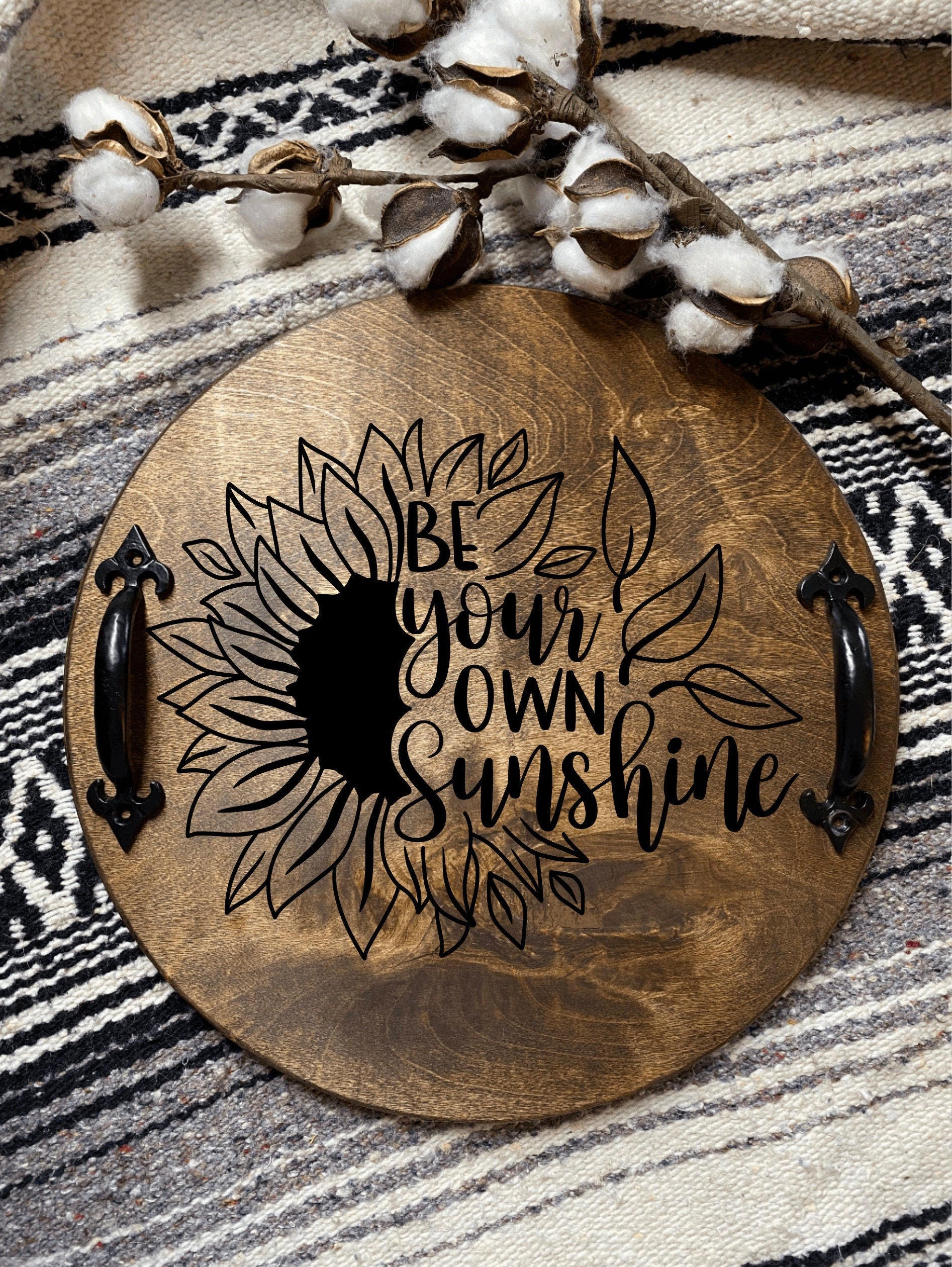 Handmade wooden serving tray with sunflower design and black metal handles, stained in dark chestnut color.